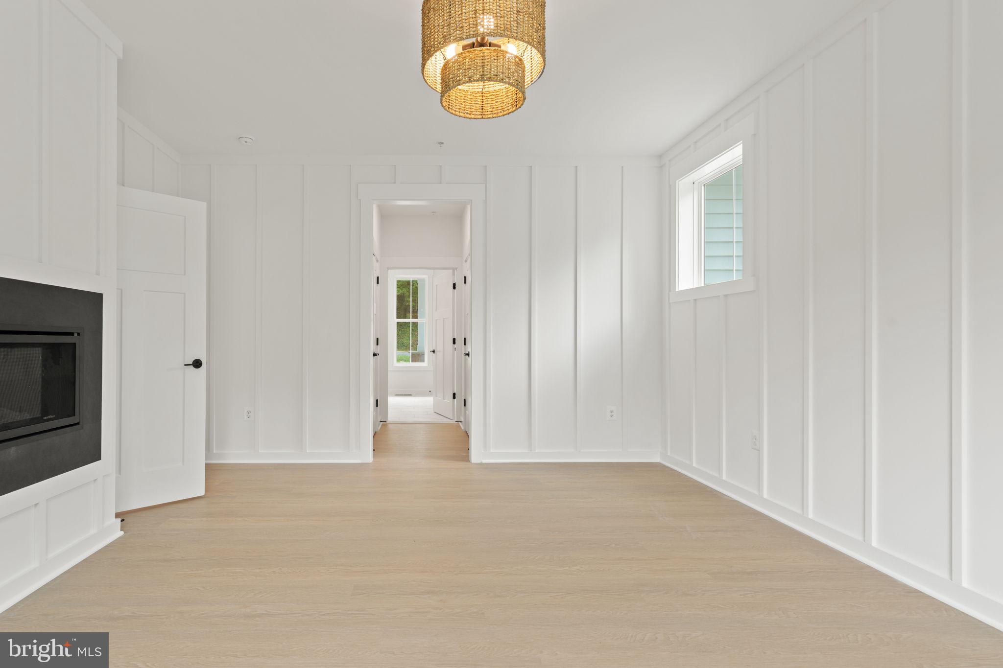640 Grim Road Stephens City, VA 22655 - Photo 24 of 50 an empty room with wooden floor and windows