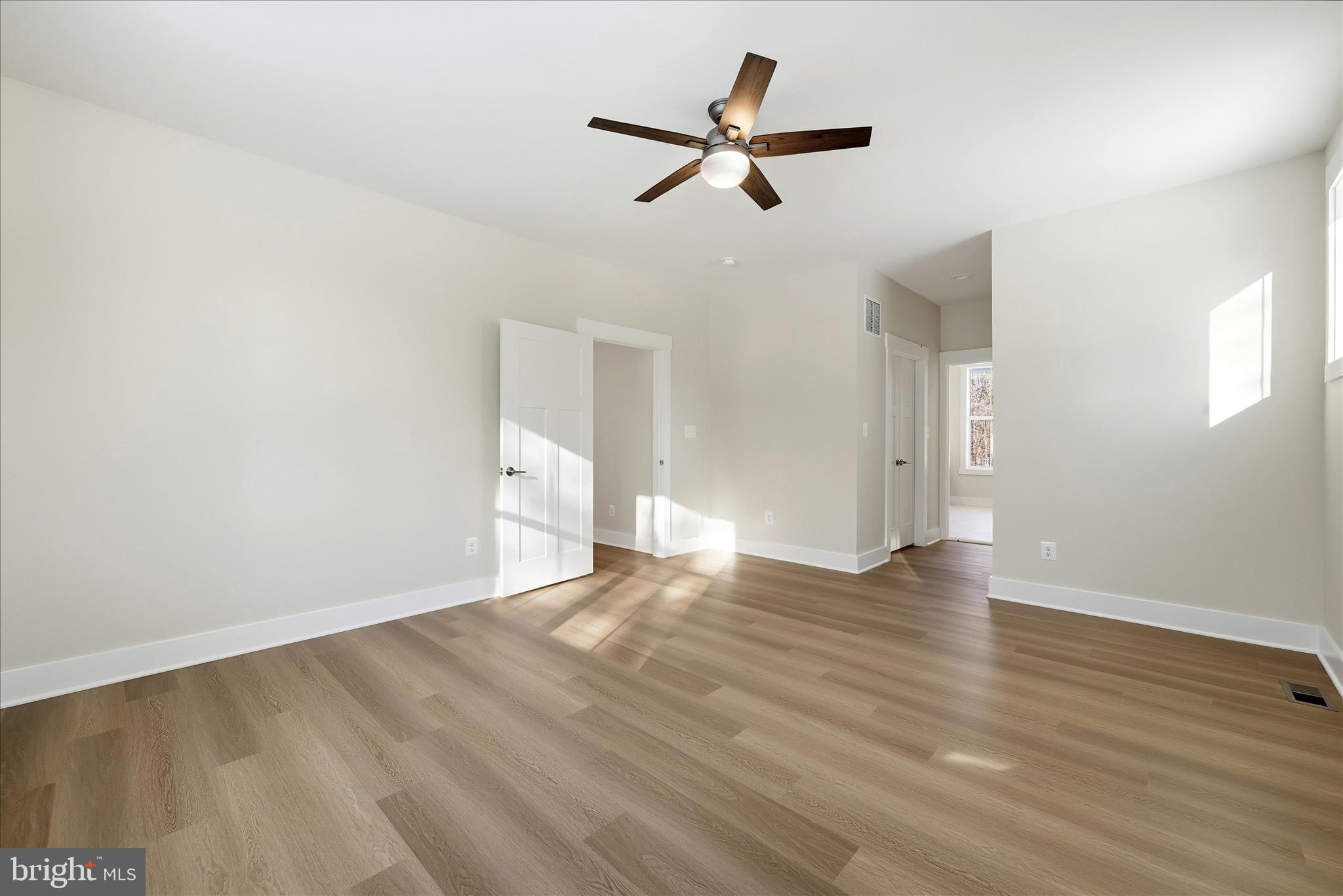 640 Grim Road Stephens City, VA 22655 - Photo 30 of 50 a view of empty room with wooden floor and ceiling fan