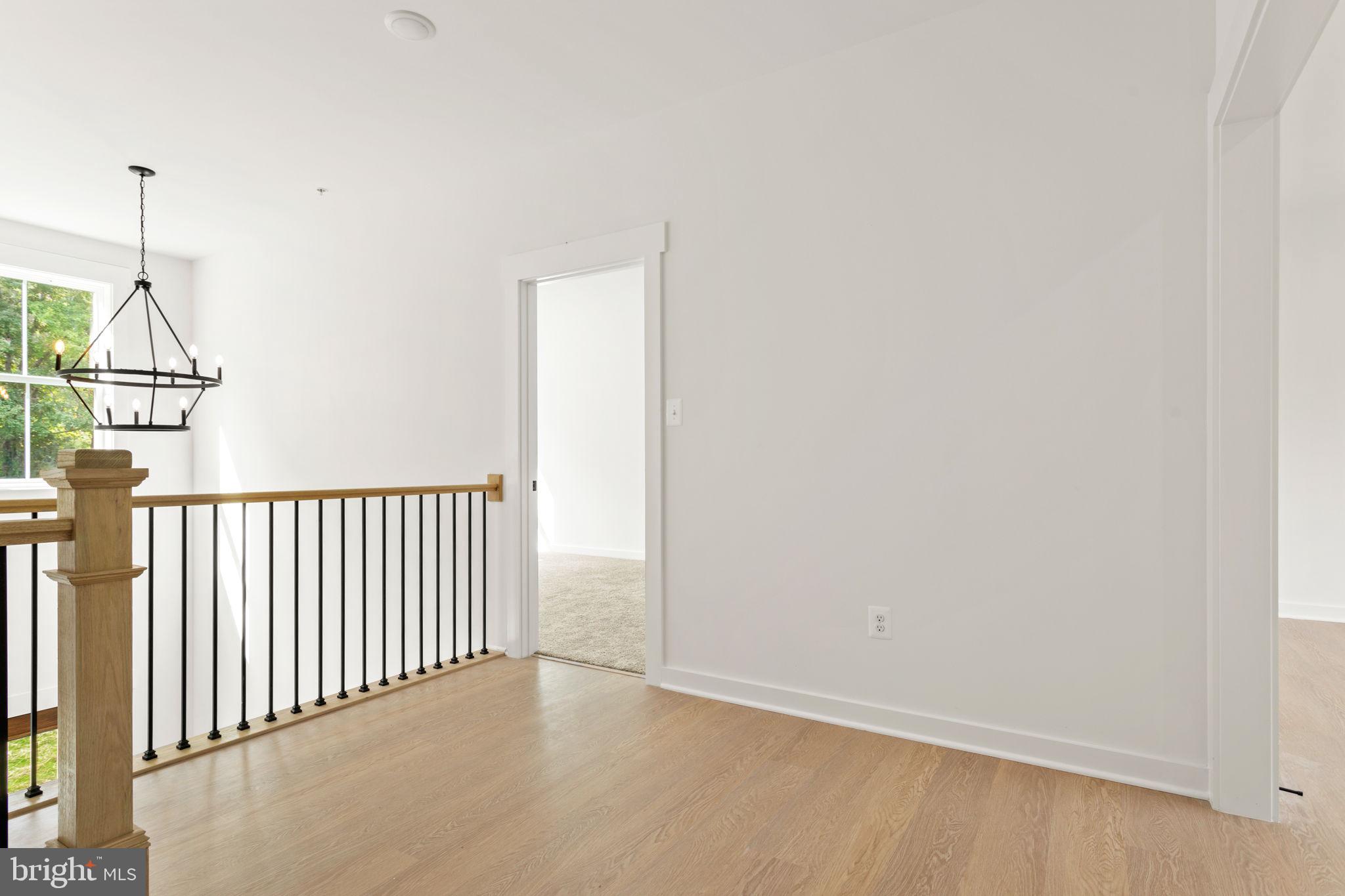 640 Grim Road Stephens City, VA 22655 - Photo 33 of 50 a view of a hallway with wooden floor and a window