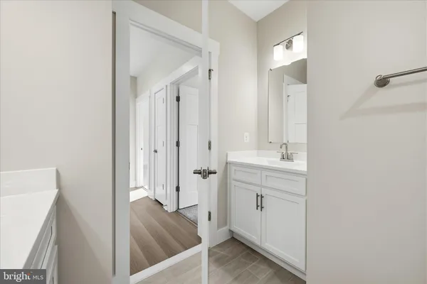 a view of a bathroom from the hallway