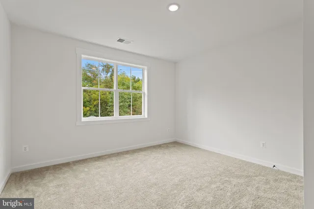 a kitchen with sink a refrigerator and furniture