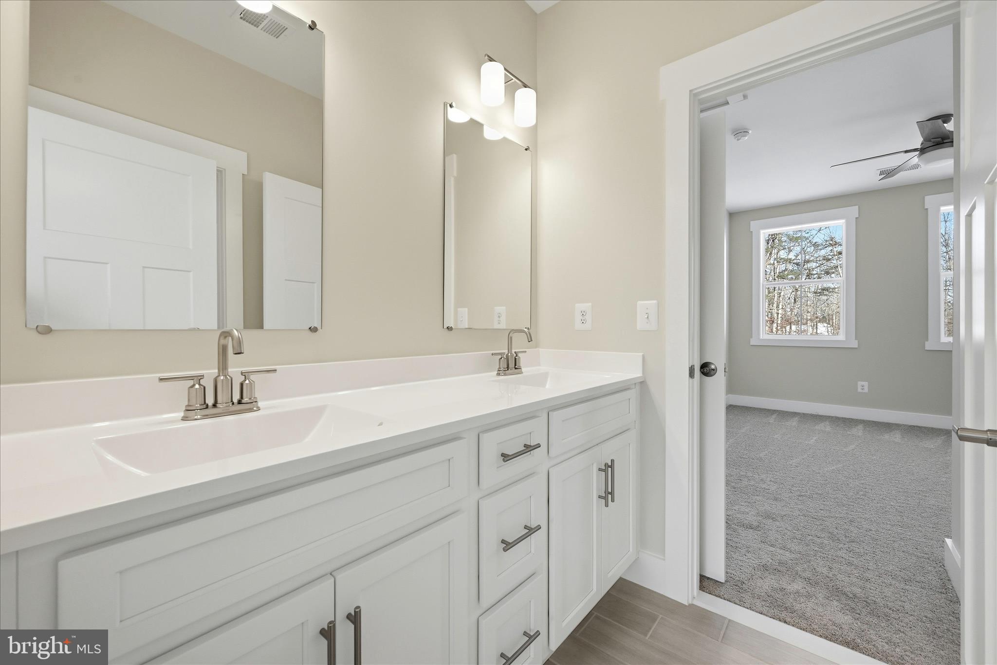 640 Grim Road Stephens City, VA 22655 - Photo 44 of 50 a bathroom with double sink and a mirror