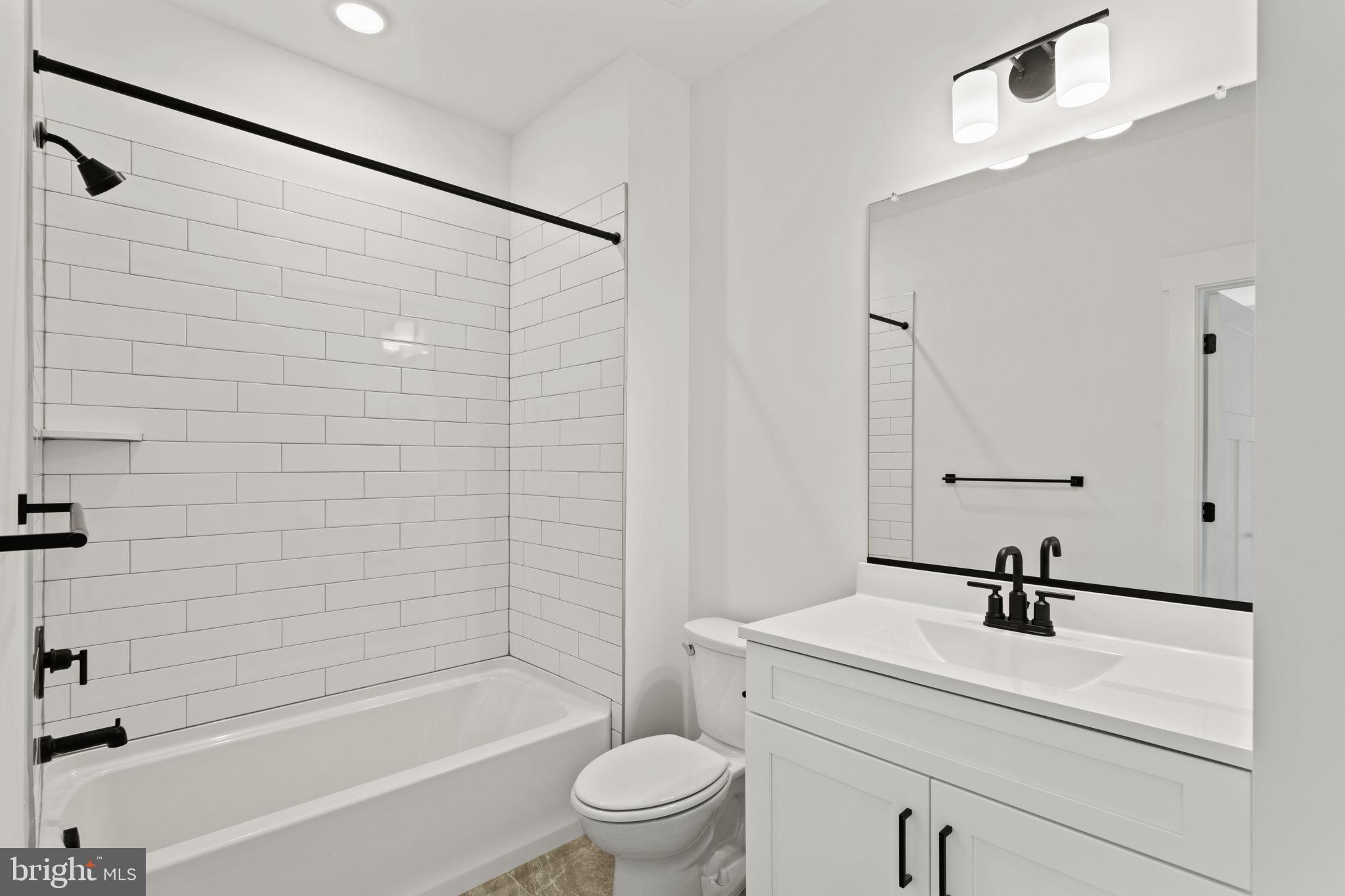 640 Grim Road Stephens City, VA 22655 - Photo 45 of 50 a bathroom with a sink a toilet and a bathtub