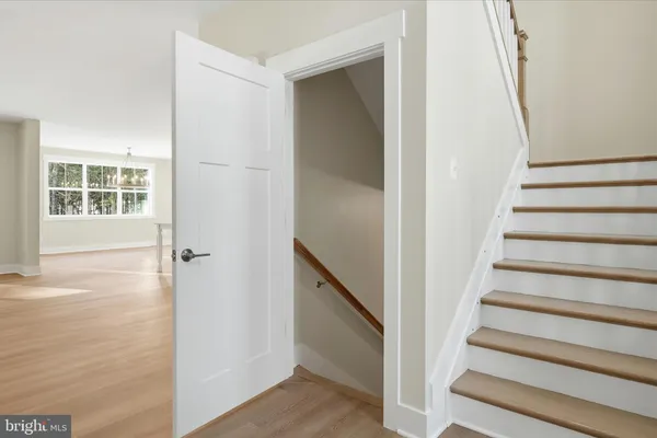 a view of an entryway with wooden floor and stairs