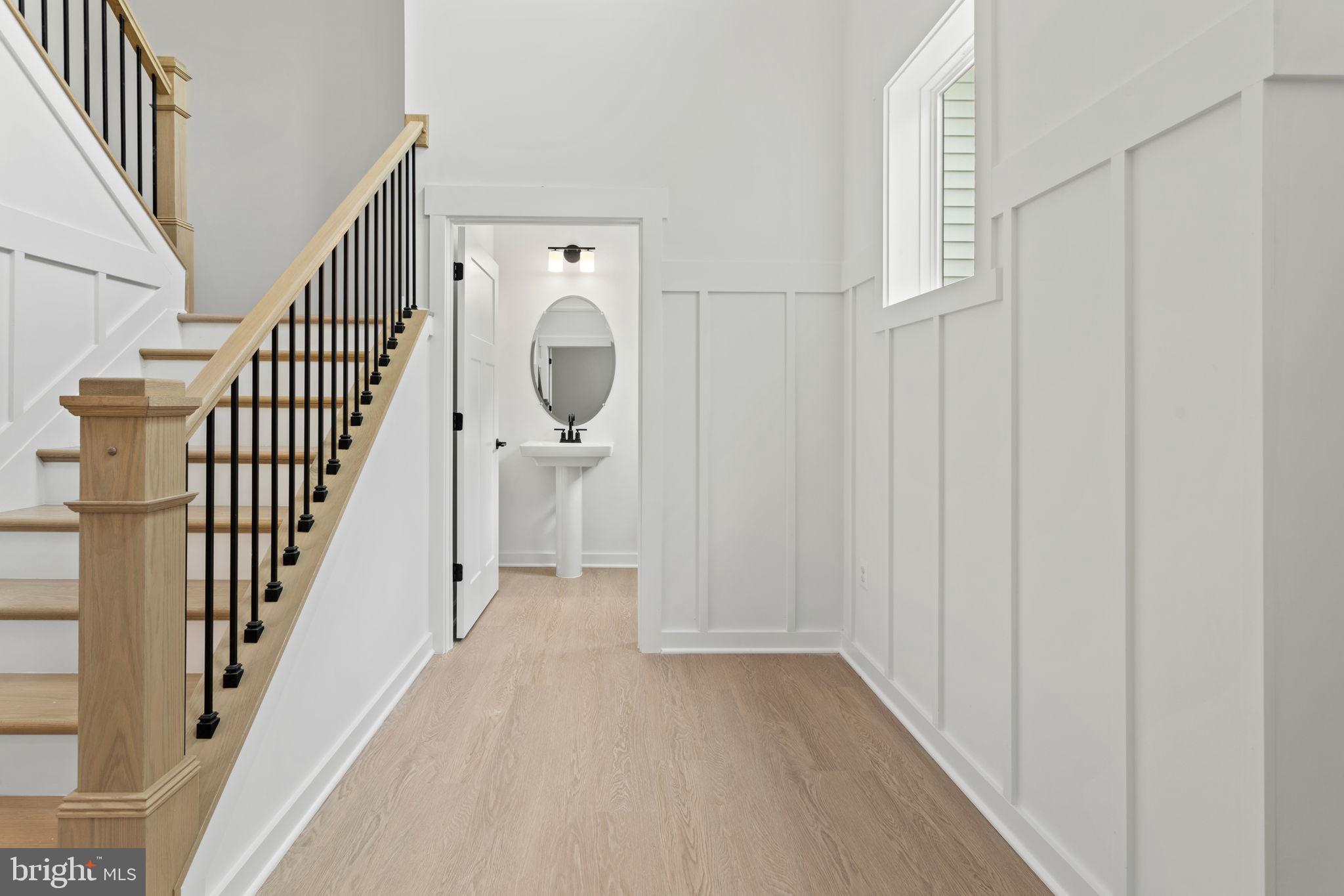 640 Grim Road Stephens City, VA 22655 - Photo 5 of 50 a view of a hallway with wooden floor and staircase