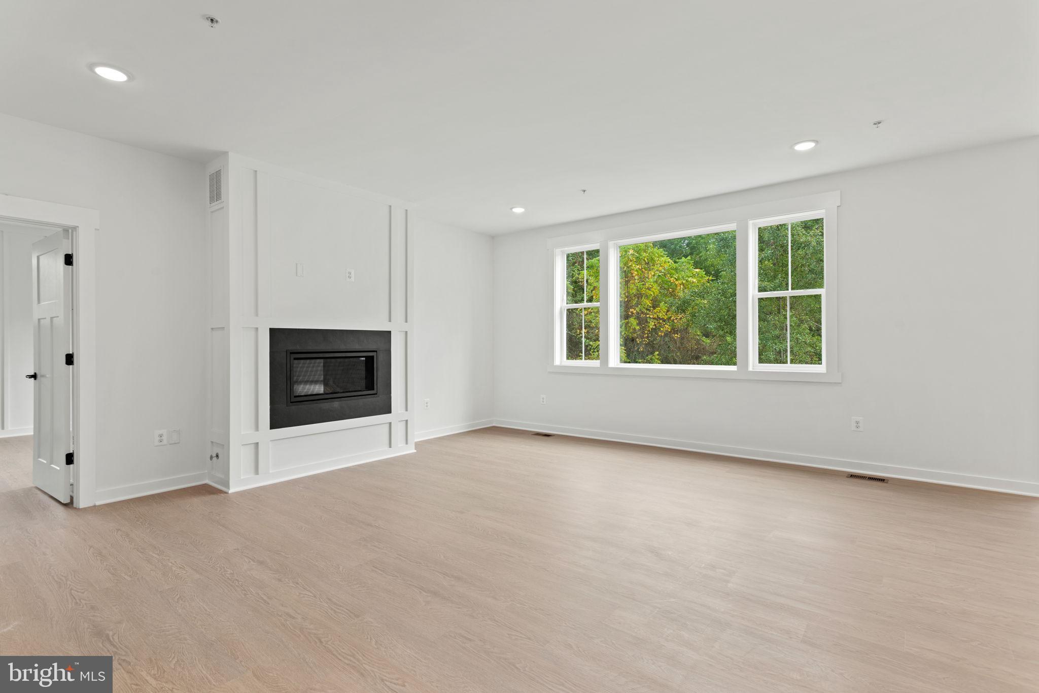 640 Grim Road Stephens City, VA 22655 - Photo 8 of 50 an empty room with windows and fireplace