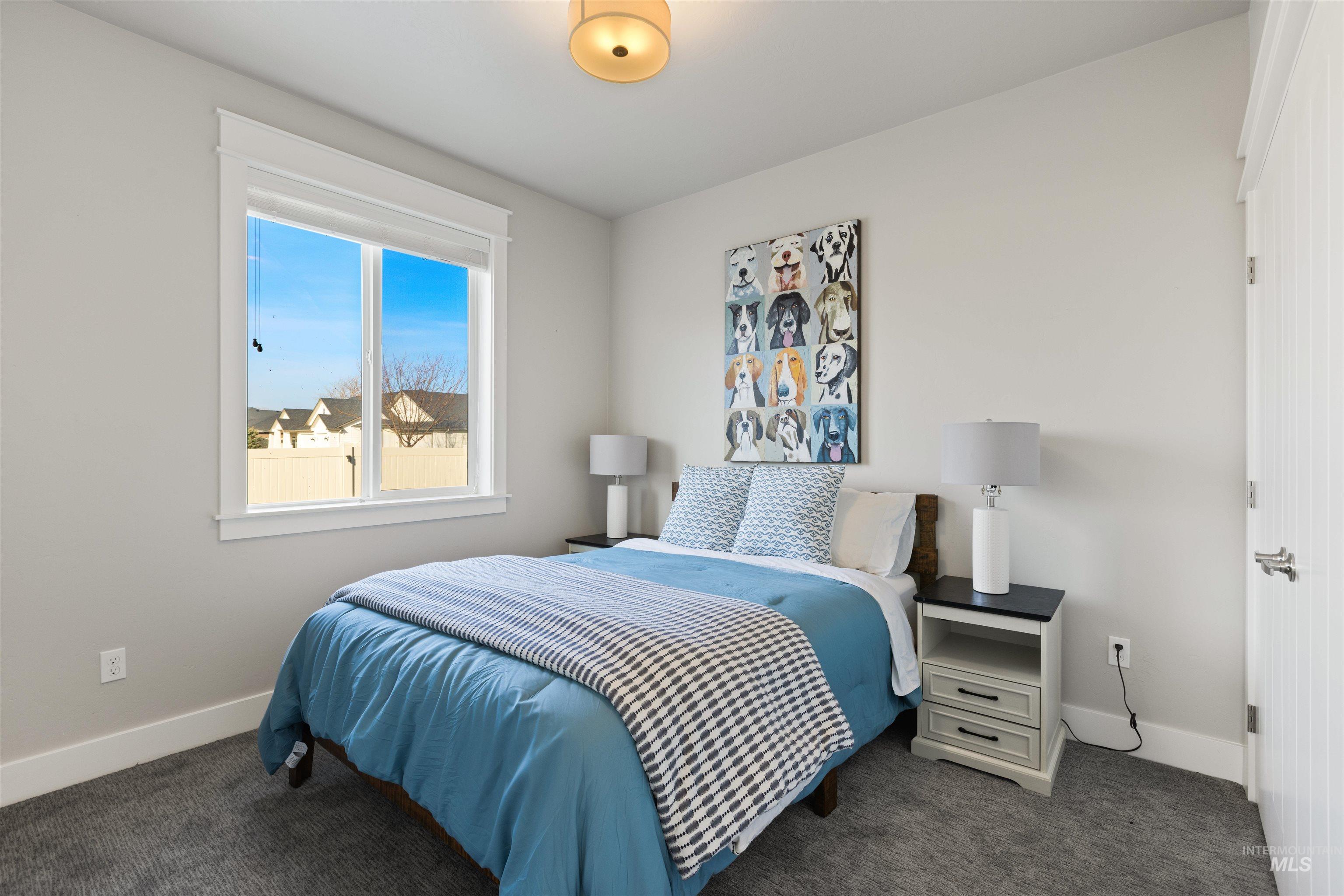 4551 South Lava Springs Loop Nampa, ID 83686 - Photo 13 of 49 Bedroom featuring baseboards and carpet floors