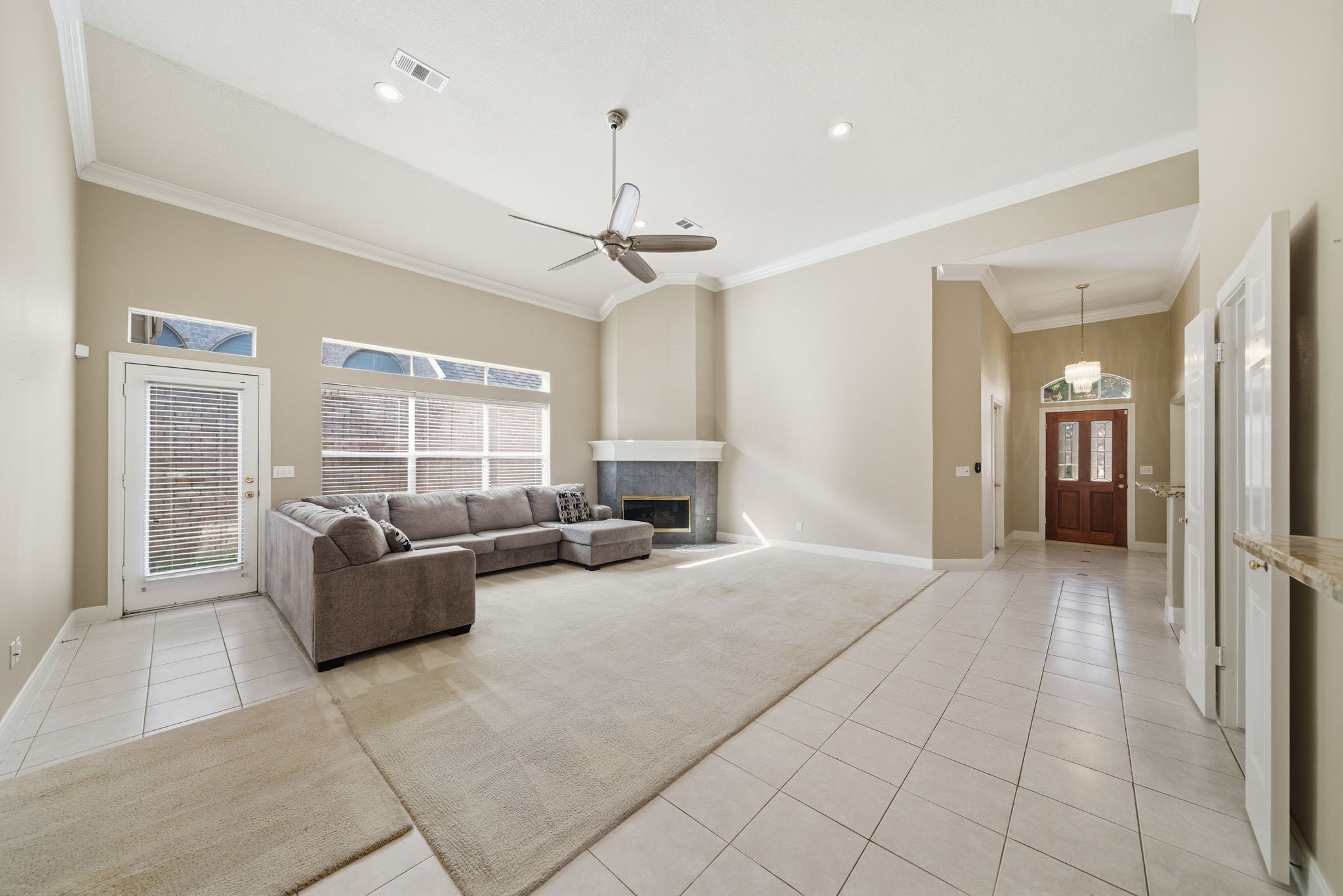 19803 Excalibur Court Houston, TX 77094 - Photo 15 of 34 a living room with furniture and a chandelier