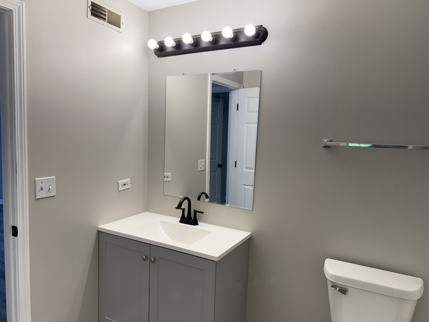 1411 Berta Drive, Unit 2N Crest Hill, IL 60403 - Photo 11 of 20 a bathroom with a sink and a mirror