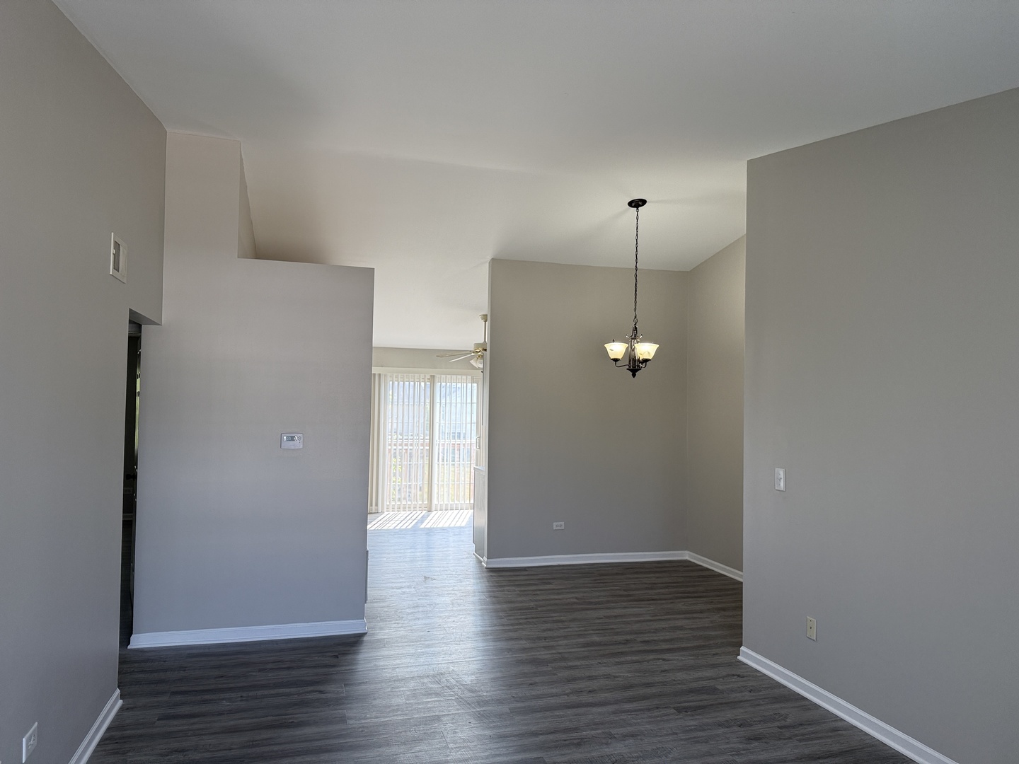 1411 Berta Drive, Unit 2N Crest Hill, IL 60403 - Photo 16 of 20 a view of a room with wooden floor and a ceiling fan