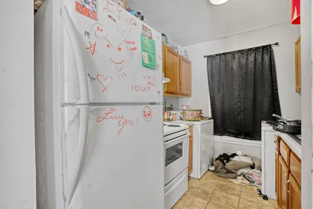 a kitchen with stainless steel appliances a stove a microwave and cabinets