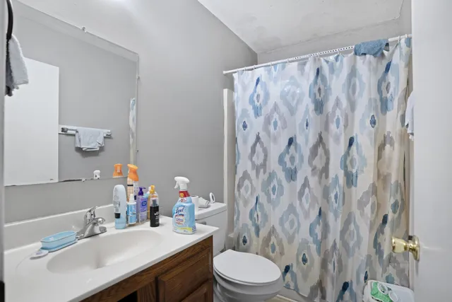 a bed room with a bed and a view of bedroom