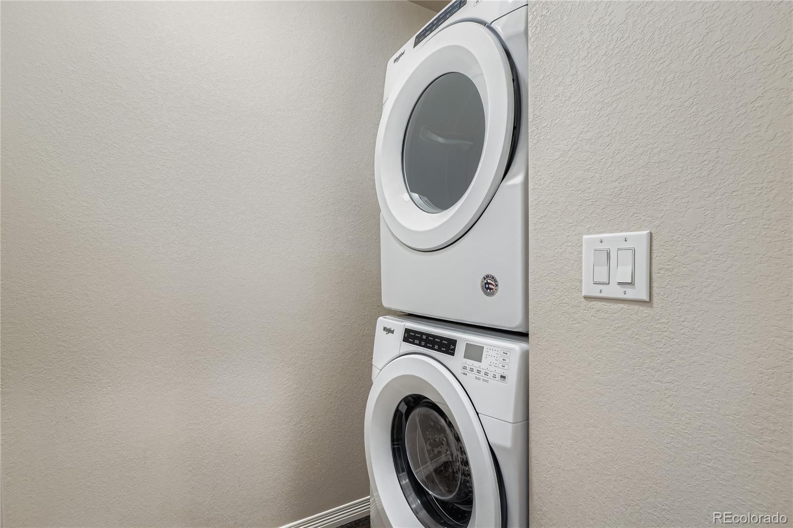 4767 Memphis Street Denver, CO 80239 - Photo 15 of 17 a utility room with dryer and washer