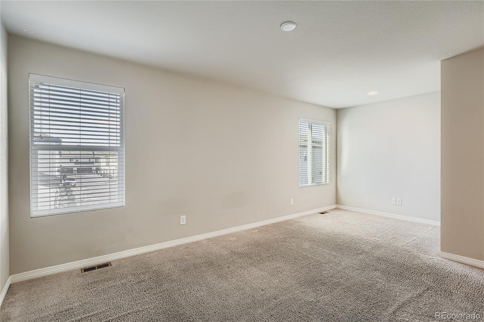 4767 Memphis Street Denver, CO 80239 - Photo 9 of 17 a view of an empty room with a window