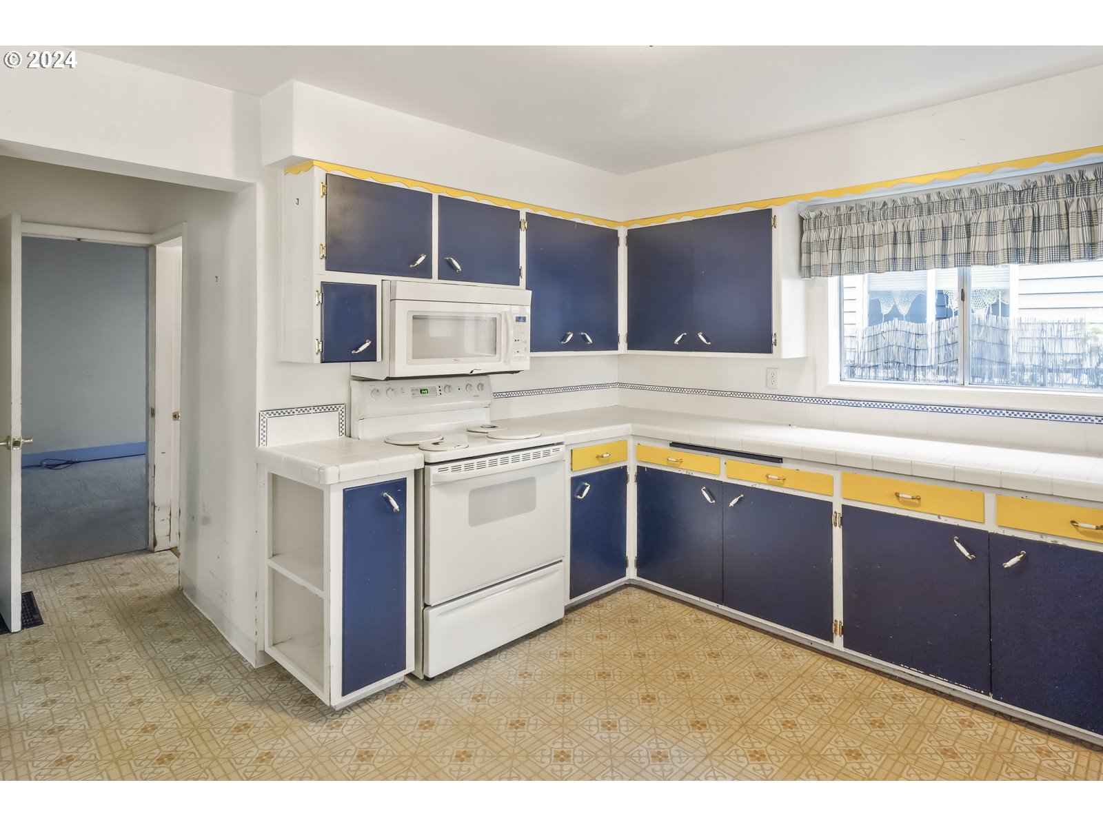 4417 Southeast 65th Avenue Portland, OR 97206 - Photo 13 of 38 a kitchen with stainless steel appliances granite countertop a stove and a sink