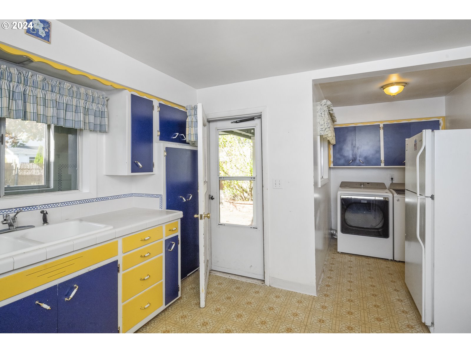 4417 Southeast 65th Avenue Portland, OR 97206 - Photo 18 of 38 a kitchen with a refrigerator and a sink