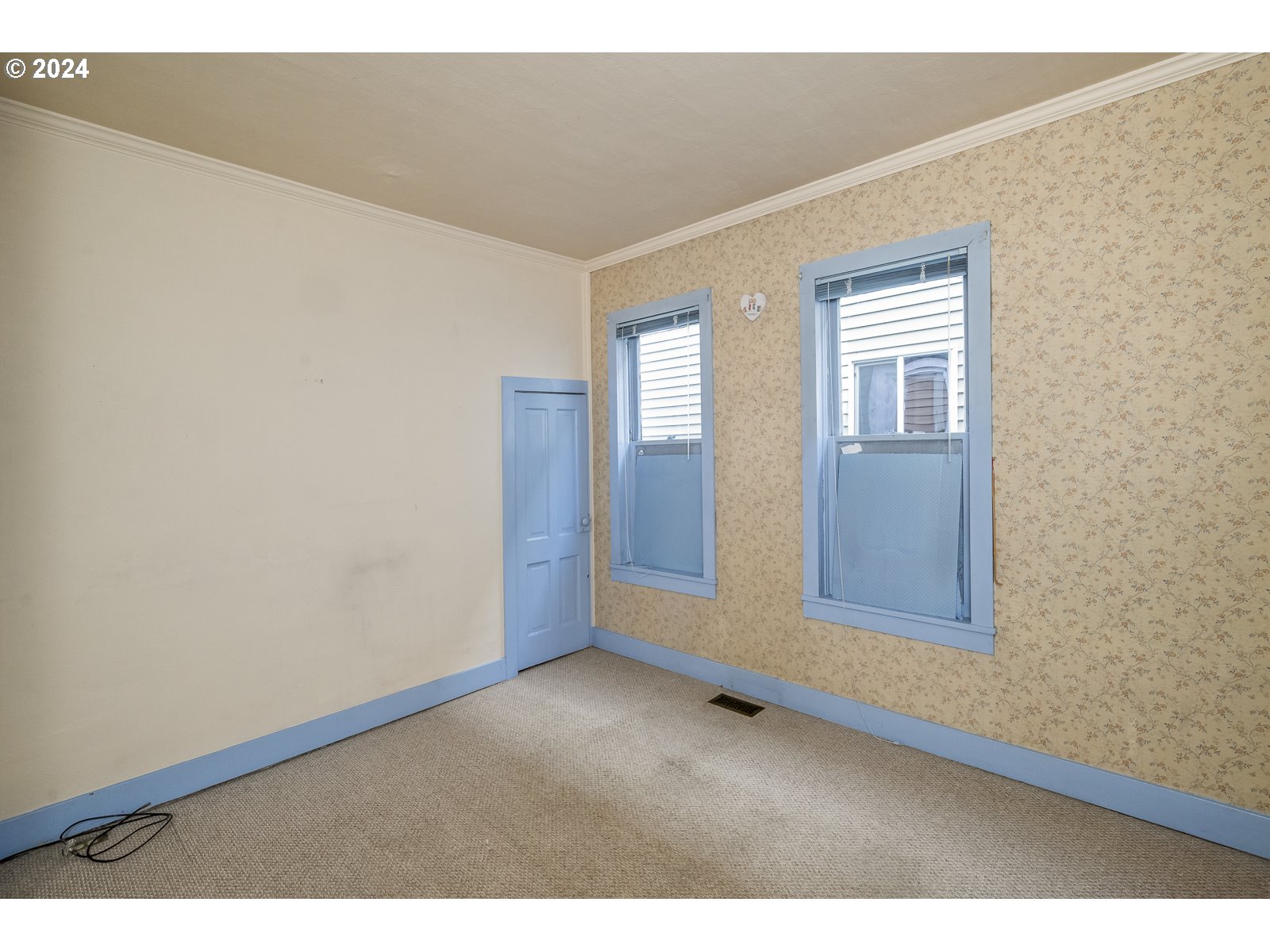 4417 Southeast 65th Avenue Portland, OR 97206 - Photo 19 of 38 a view of an empty room with wooden floor and a window