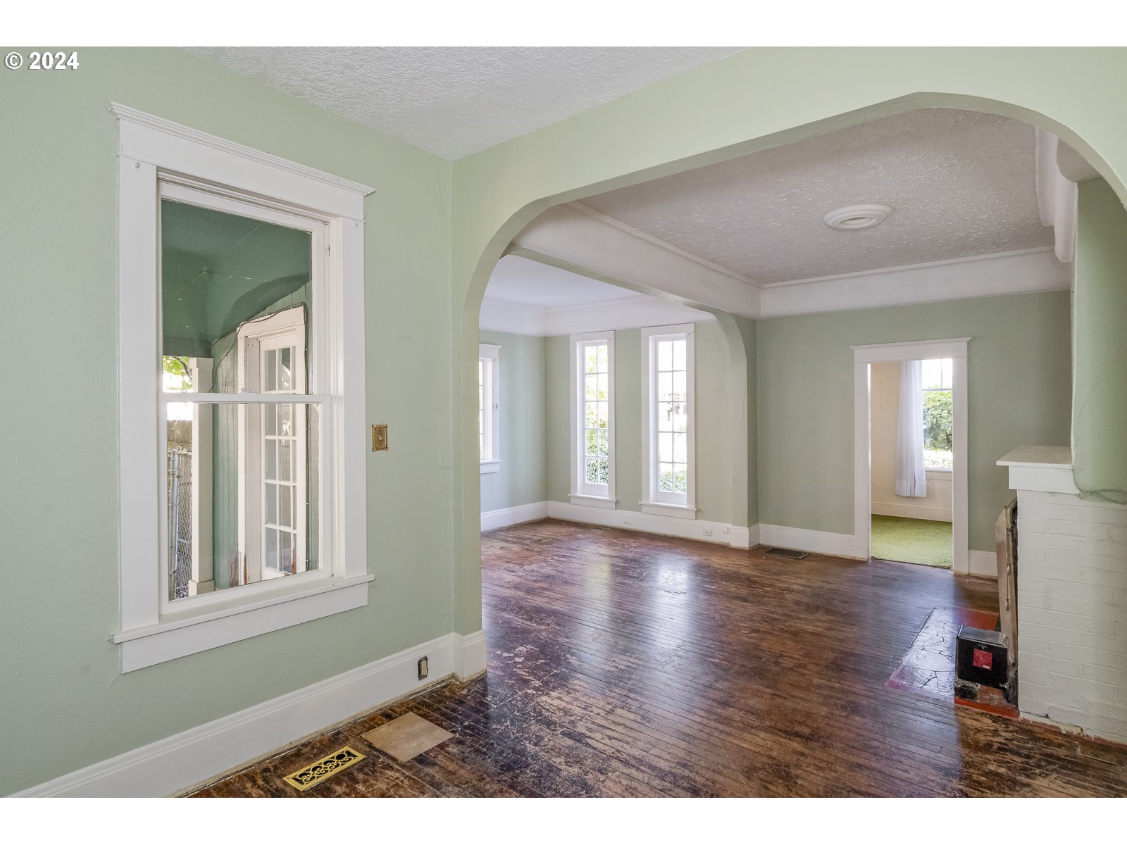 4417 Southeast 65th Avenue Portland, OR 97206 - Photo 9 of 38 a view interior of a house with wooden floor and windows
