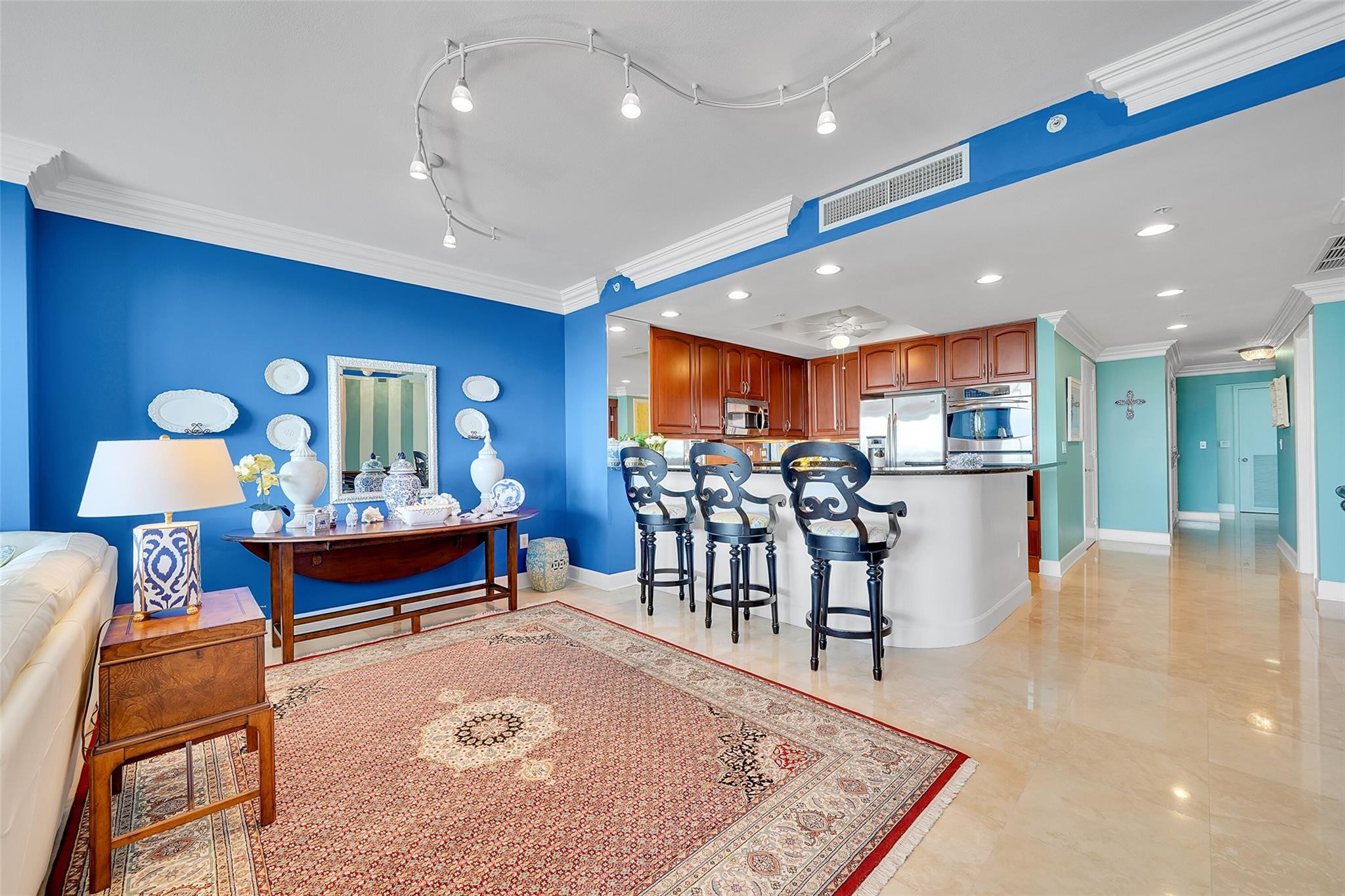 821 North Riverside Drive, Unit PH2 Pompano Beach, FL 33062 - Photo 25 of 95 a living room with furniture and a table