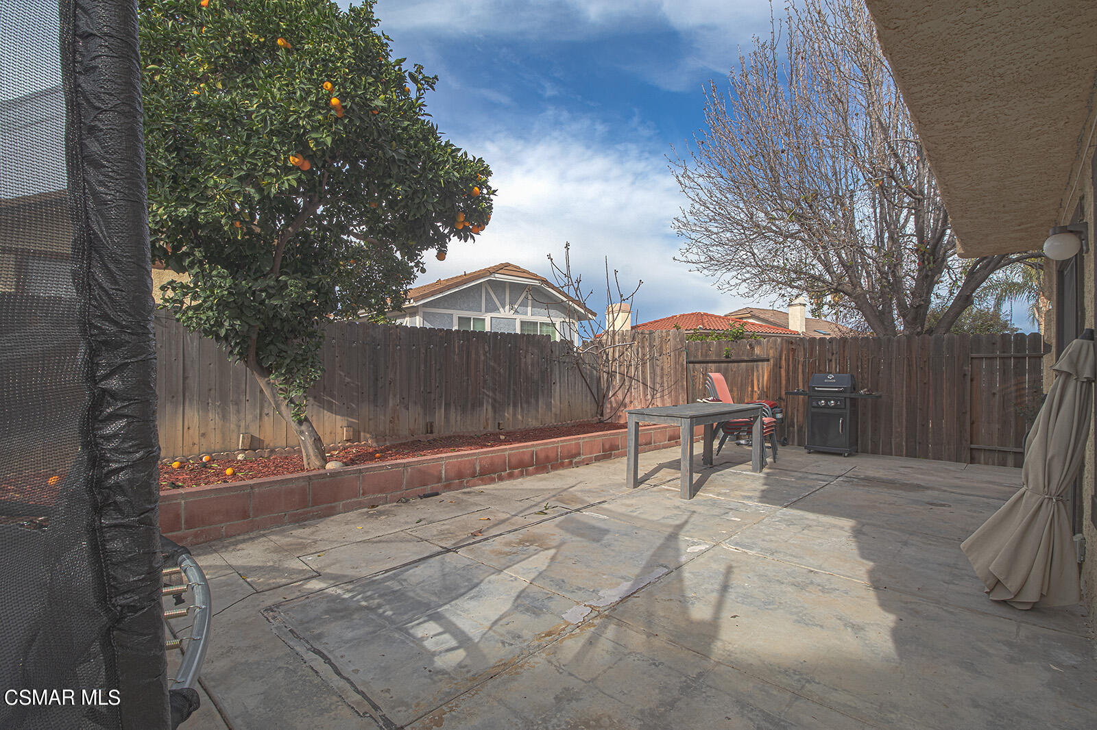 831 Devon Court Simi Valley, CA 93065 - Photo 22 of 22 a backyard of a house with table and chairs