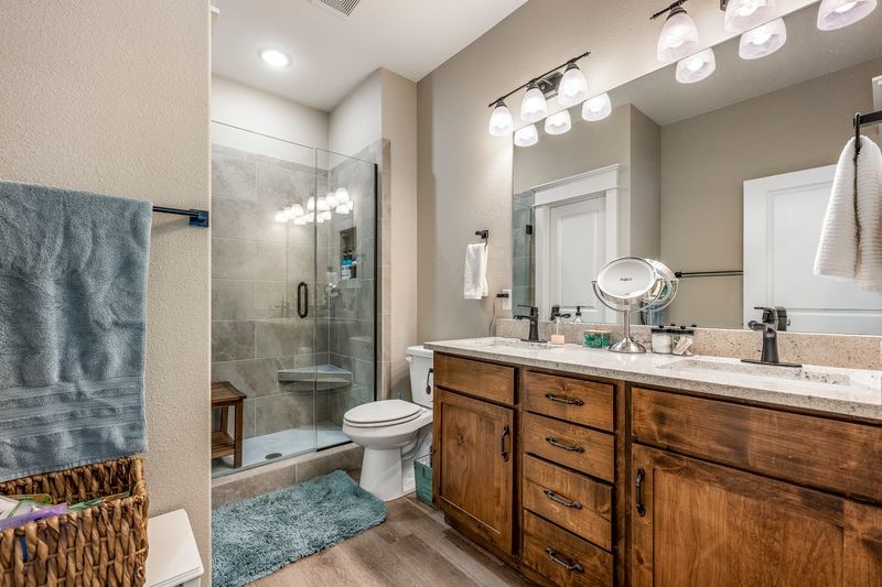 10859 Danny Bryan Road Prairie Grove, AR 72753 - Photo 8 of 30 Primary Bathroom featuring double vanity and a custom tiled shower.