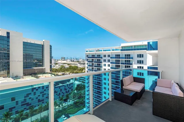 a work room with furniture and a book shelf