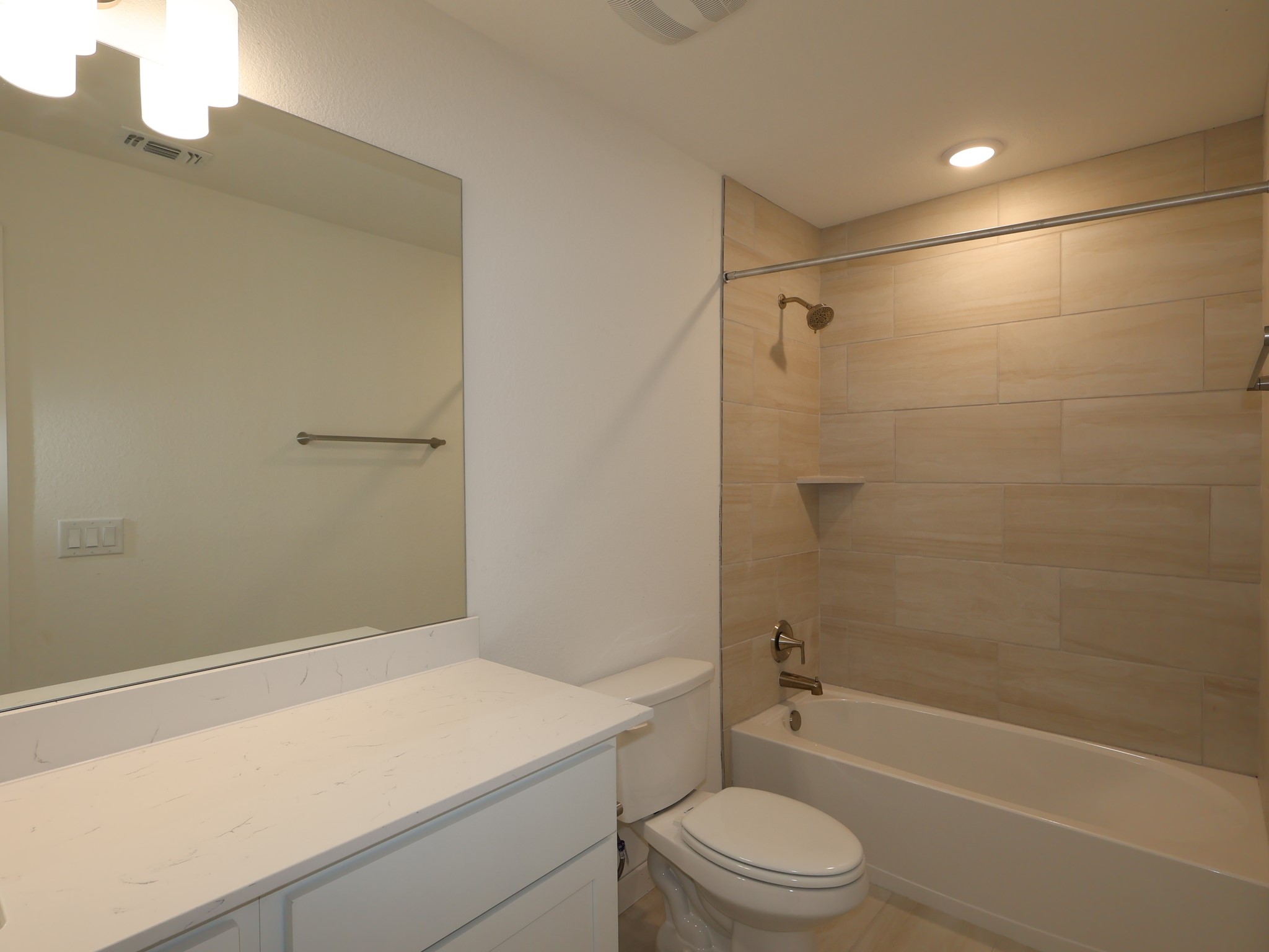 3977 Waco Way Leander, TX 78641 - Photo 18 of 23 a bathroom with a toilet a sink and a shower
