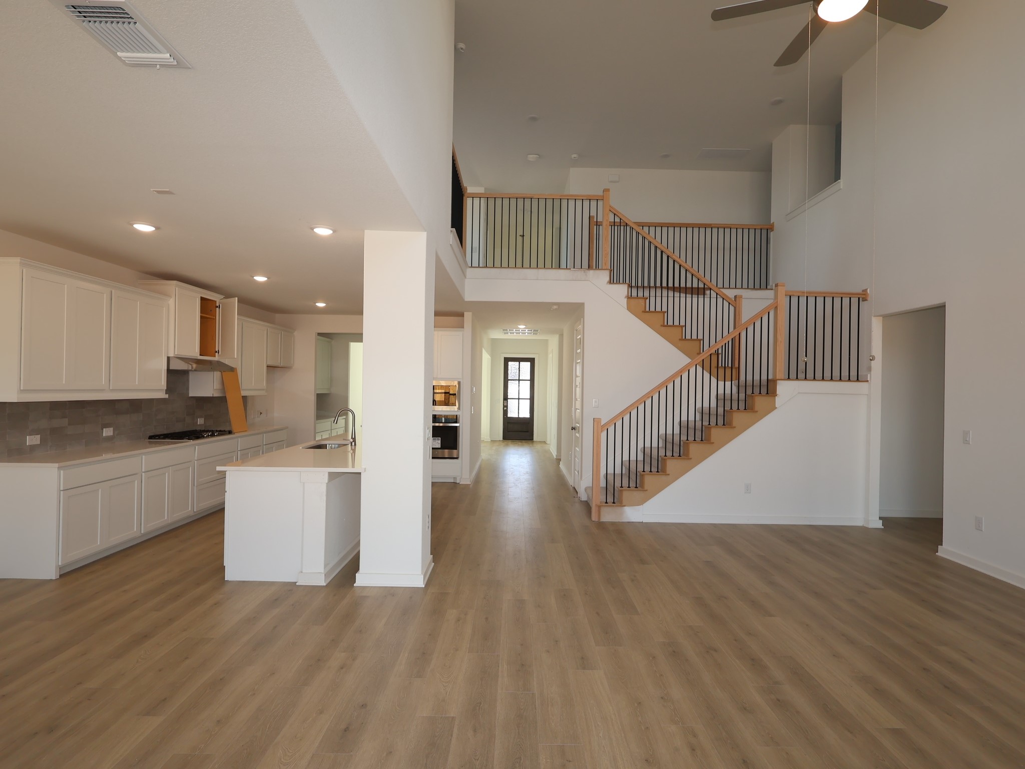 3977 Waco Way Leander, TX 78641 - Photo 2 of 23 a view of kitchen with wooden floor and electronic appliances