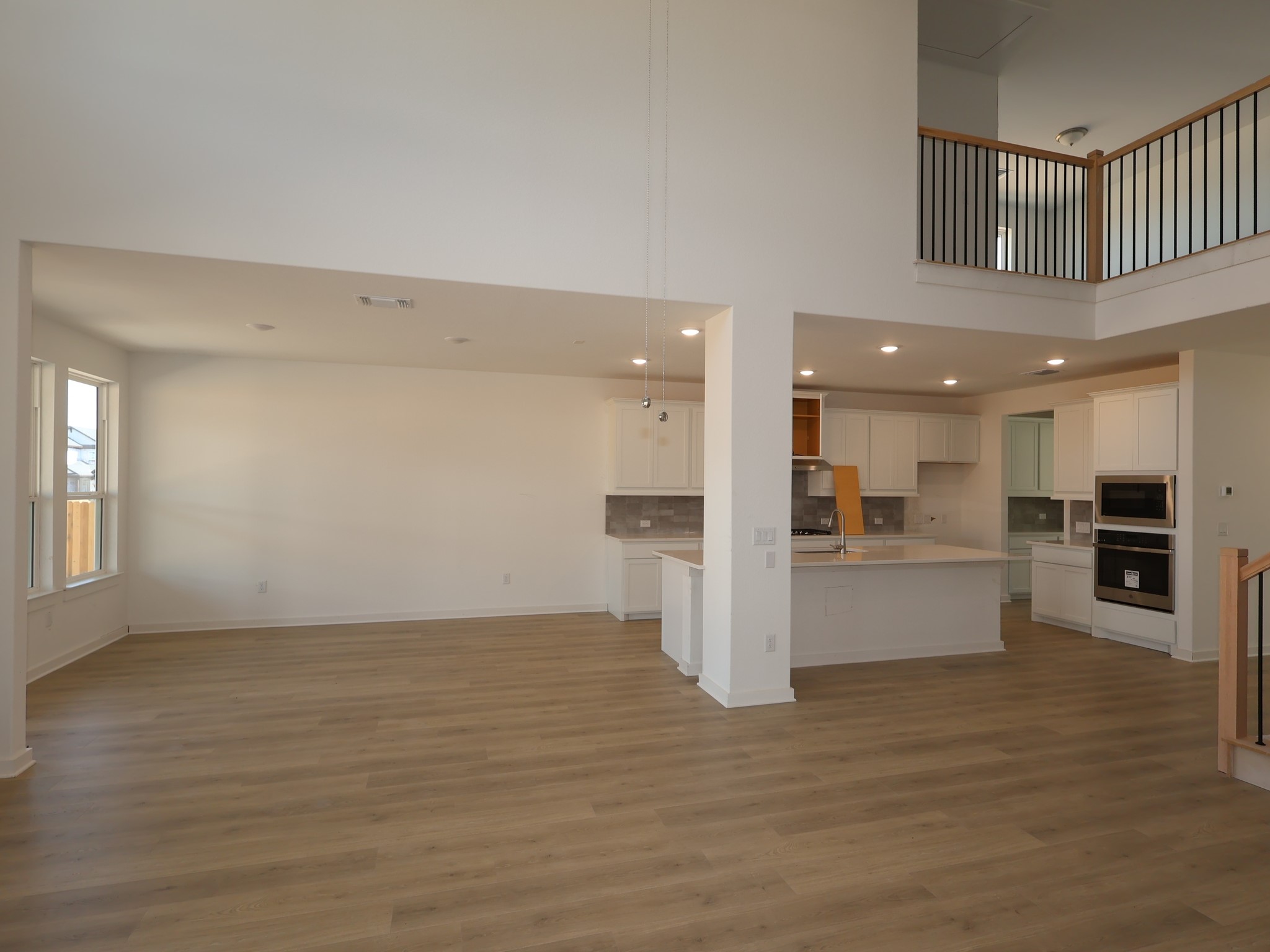 3977 Waco Way Leander, TX 78641 - Photo 5 of 23 a view of kitchen with cabinets and wooden floor