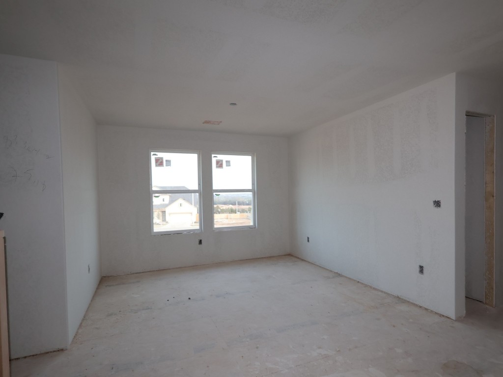 3977 Waco Way Leander, TX 78641 - Photo 6 of 11 a view of an empty room with a window