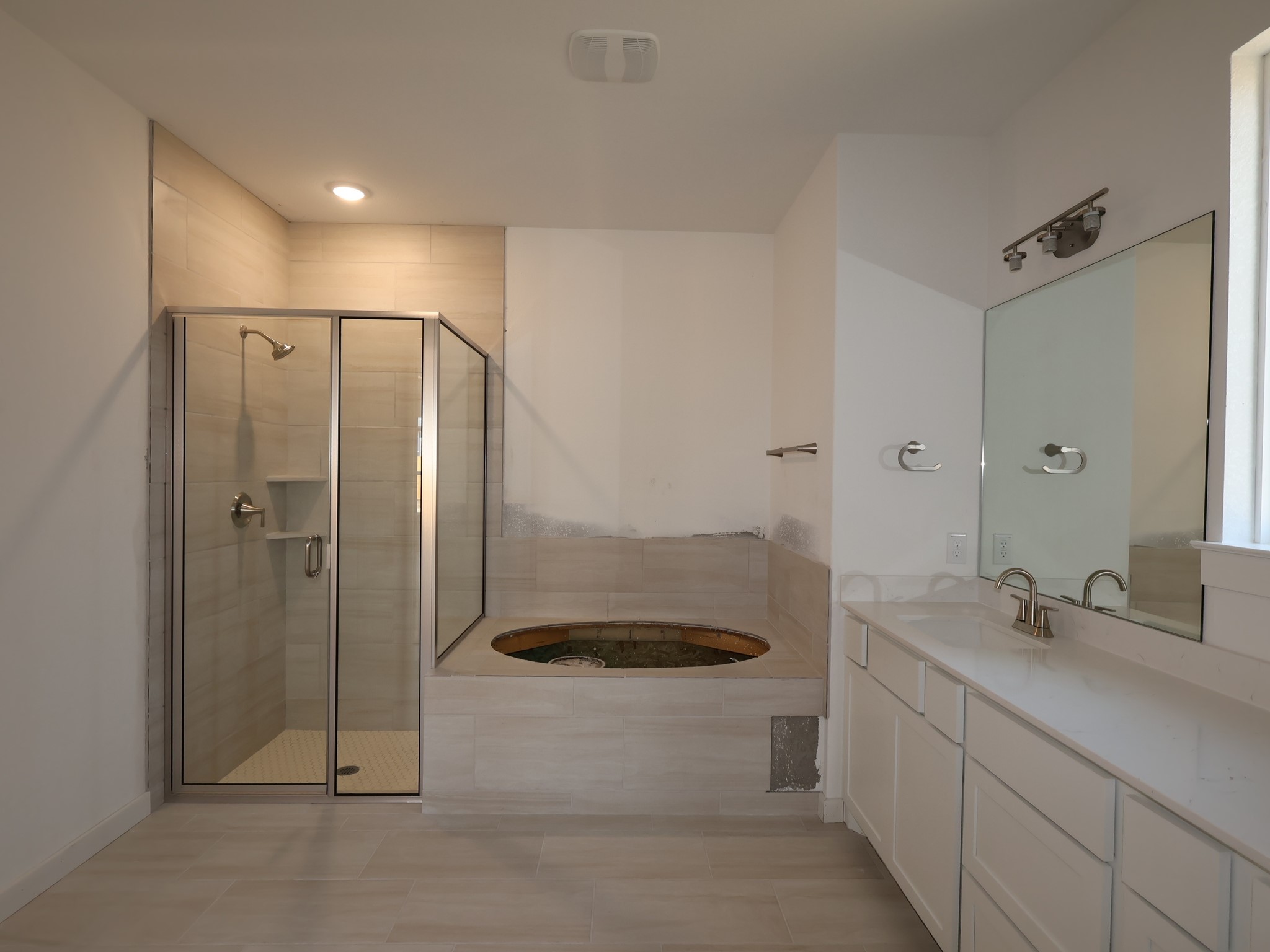 3977 Waco Way Leander, TX 78641 - Photo 7 of 23 a bathroom with a sink a toilet and shower