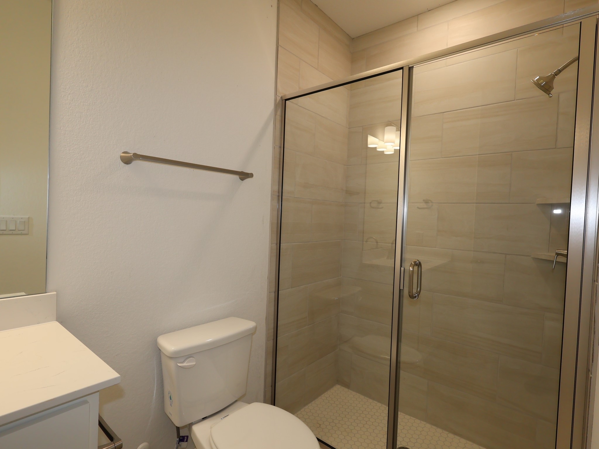 3977 Waco Way Leander, TX 78641 - Photo 9 of 23 a bathroom with a toilet and a shower