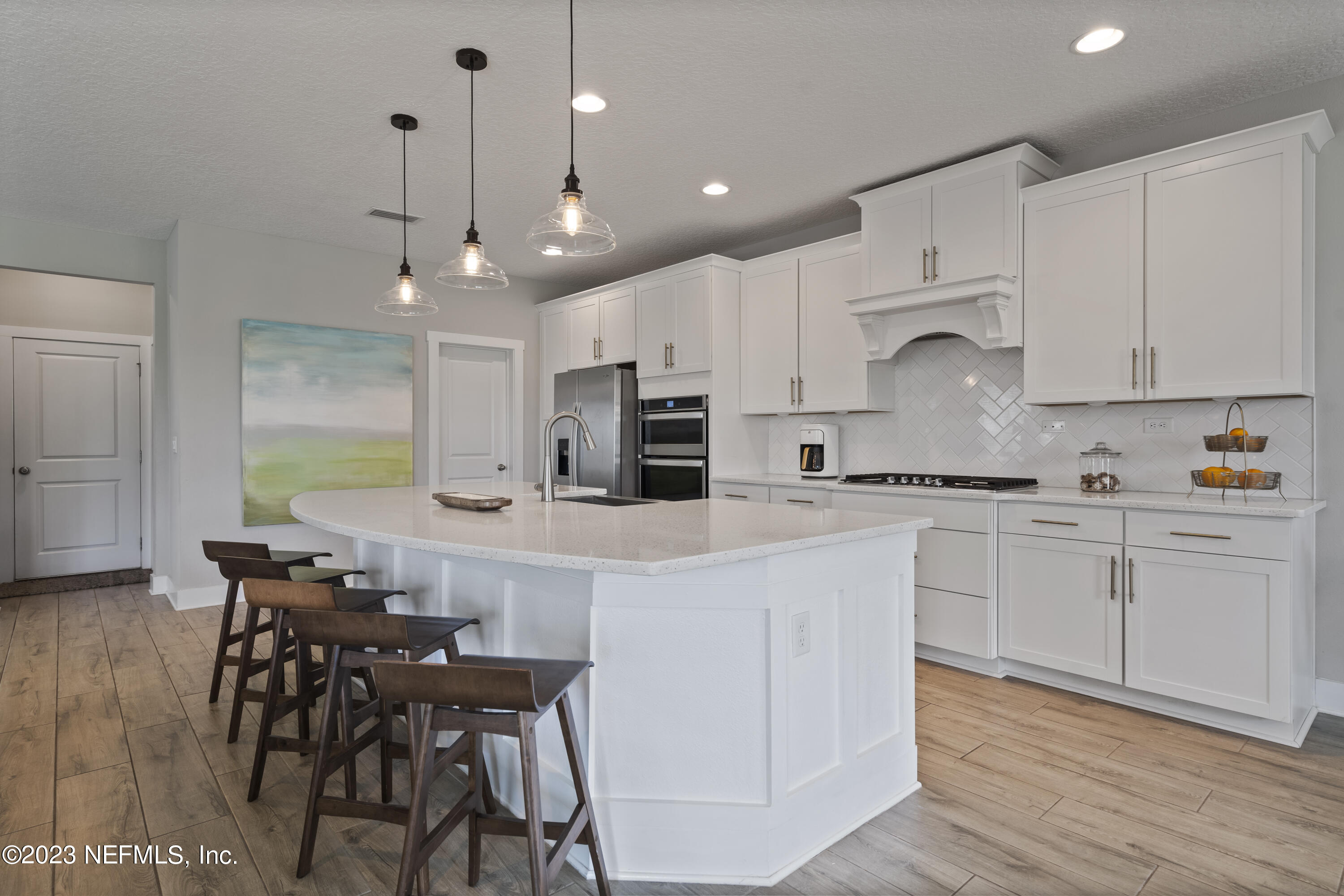 36 Strobe Court St. Augustine, FL 32095 - Photo 15 of 47 a kitchen with kitchen island granite countertop a table and chairs in it