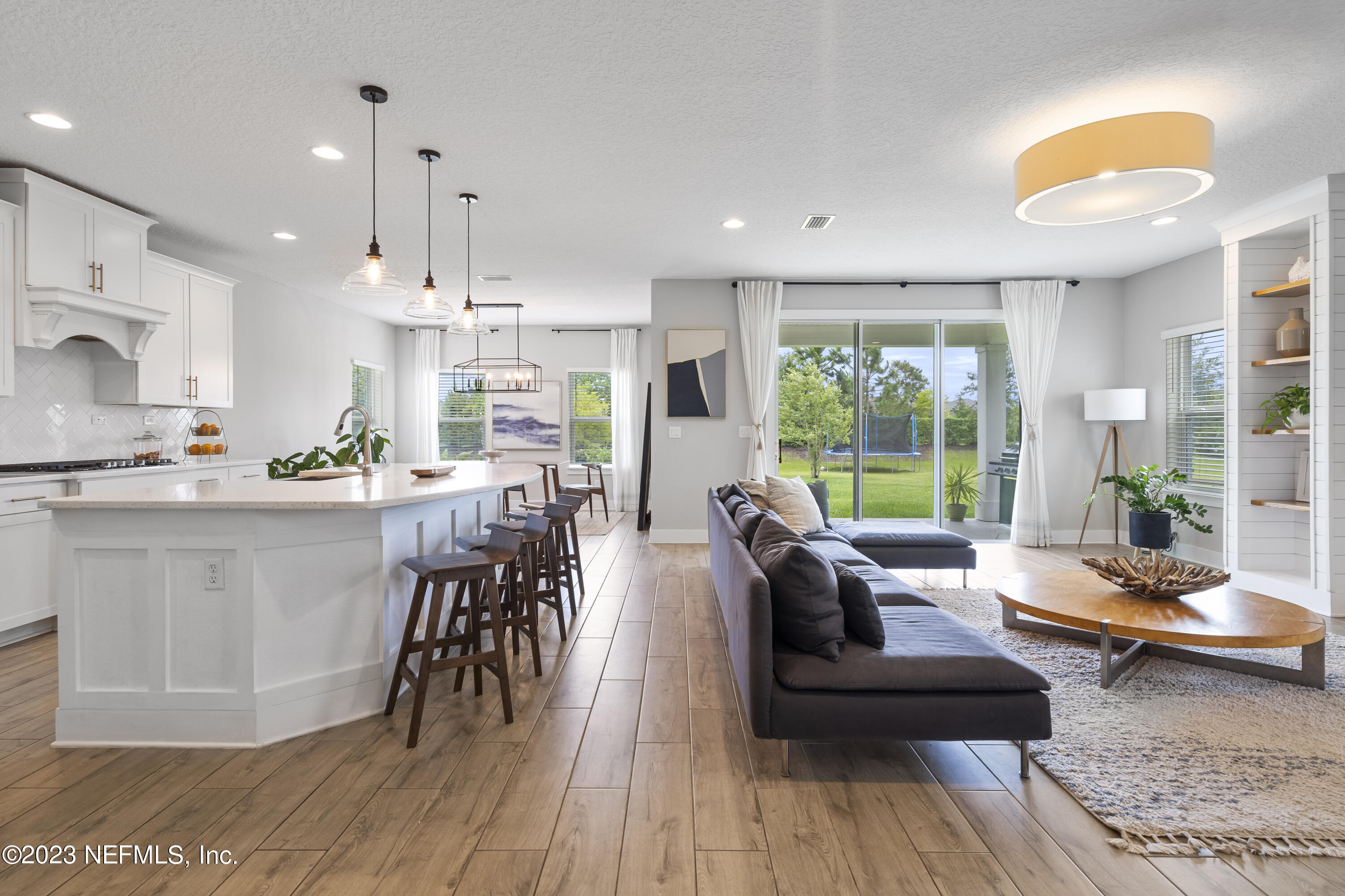 36 Strobe Court St. Augustine, FL 32095 - Photo 16 of 47 a living room with kitchen island furniture and a large window