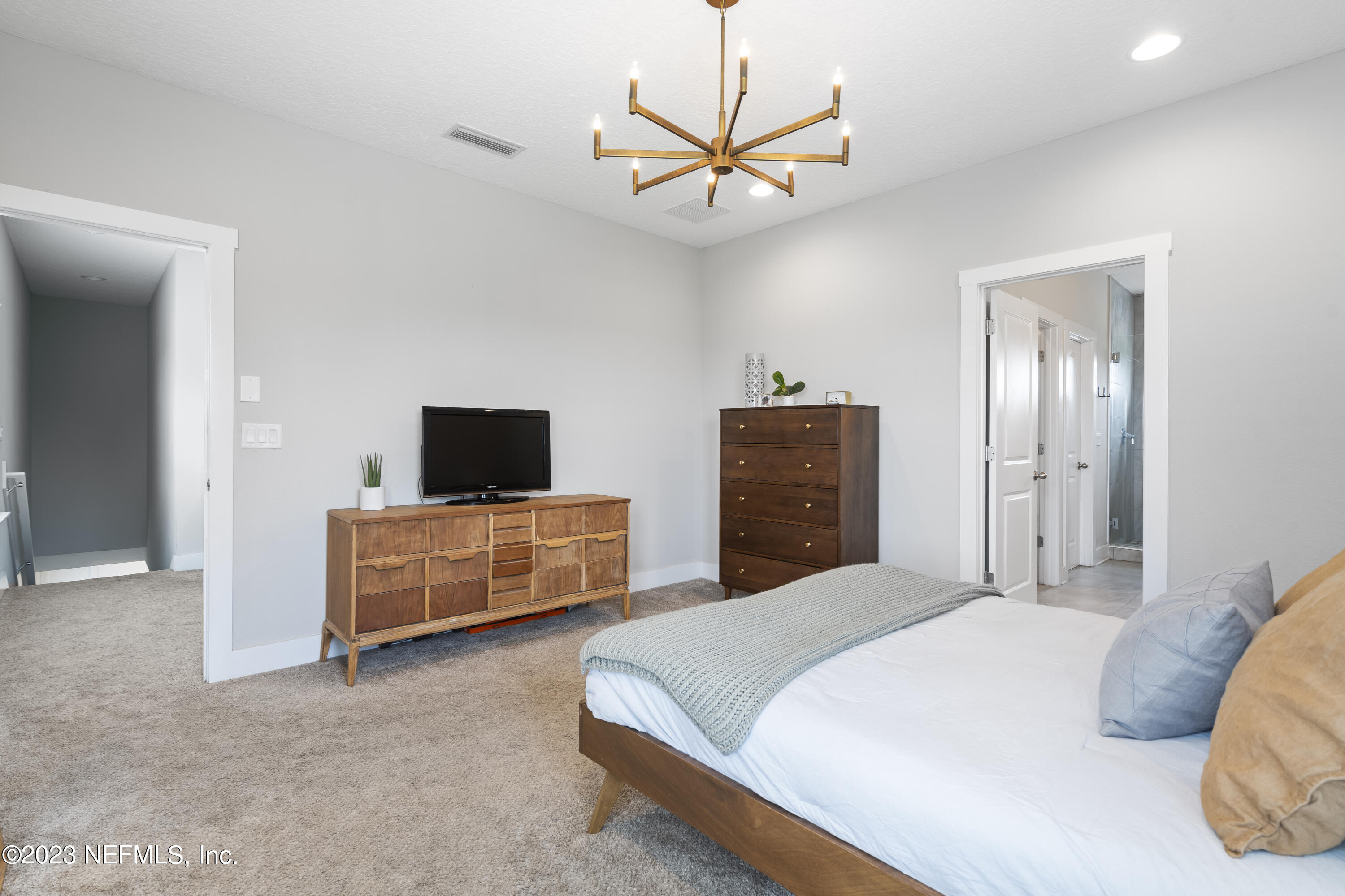 36 Strobe Court St. Augustine, FL 32095 - Photo 24 of 47 a bedroom with a bed and a television