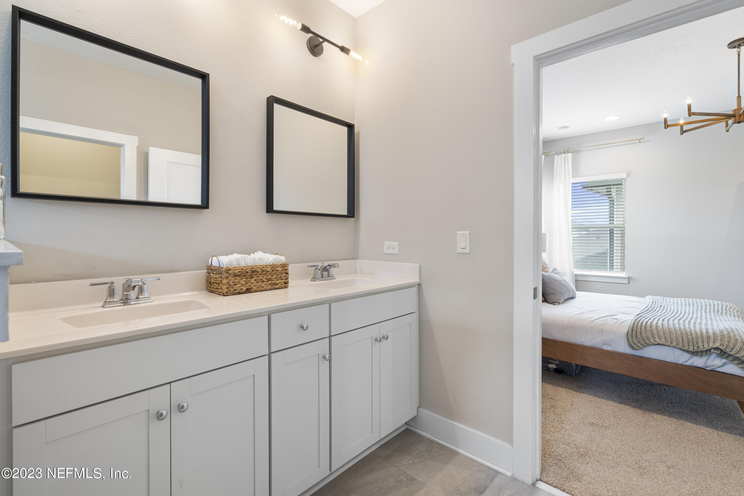 36 Strobe Court St. Augustine, FL 32095 - Photo 26 of 47 a en suite bathroom with 2 sink and a mirror