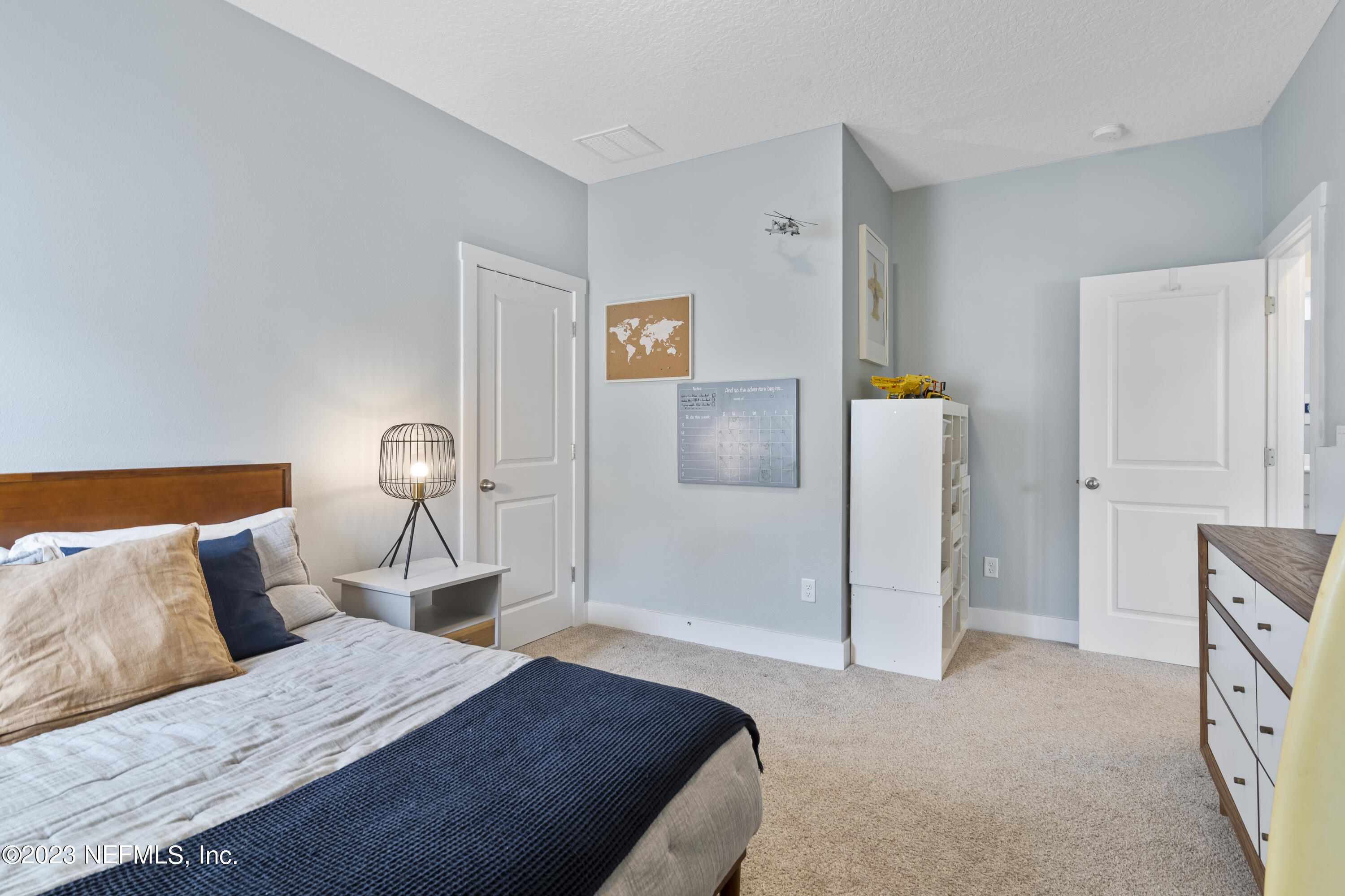 36 Strobe Court St. Augustine, FL 32095 - Photo 29 of 47 a bedroom with a bed and a lamp