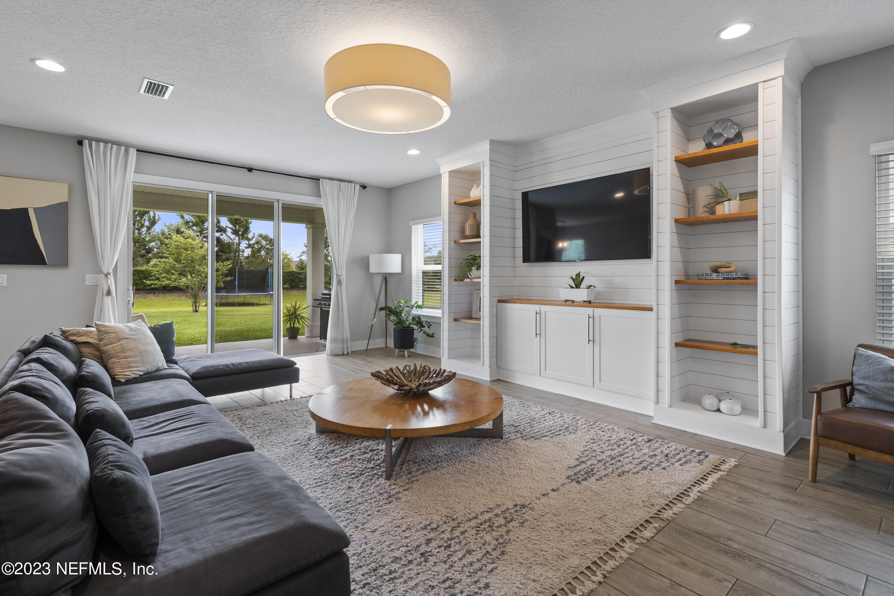 36 Strobe Court St. Augustine, FL 32095 - Photo 3 of 47 a living room with furniture and a flat screen tv