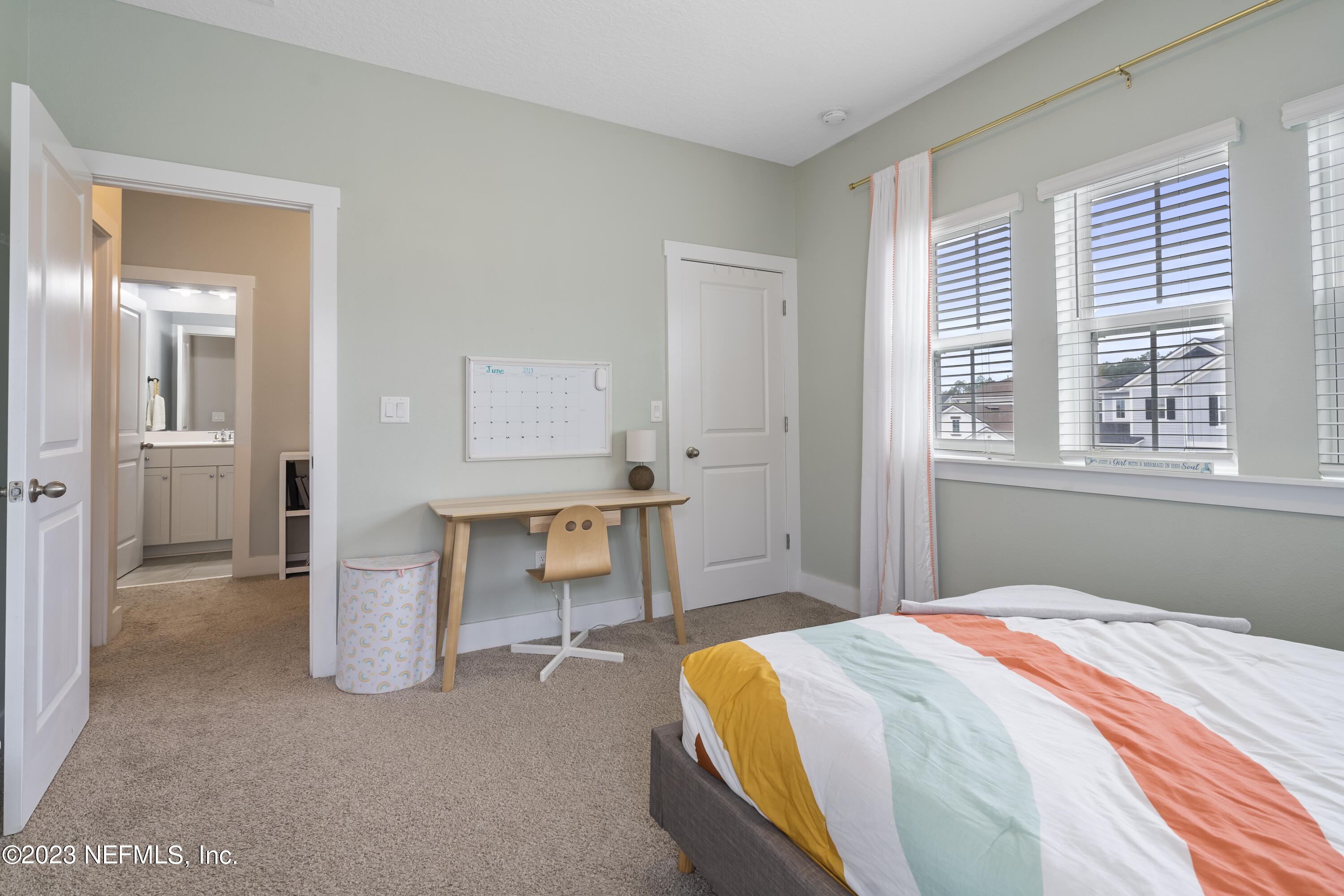 36 Strobe Court St. Augustine, FL 32095 - Photo 33 of 47 a bedroom with a bed and a table