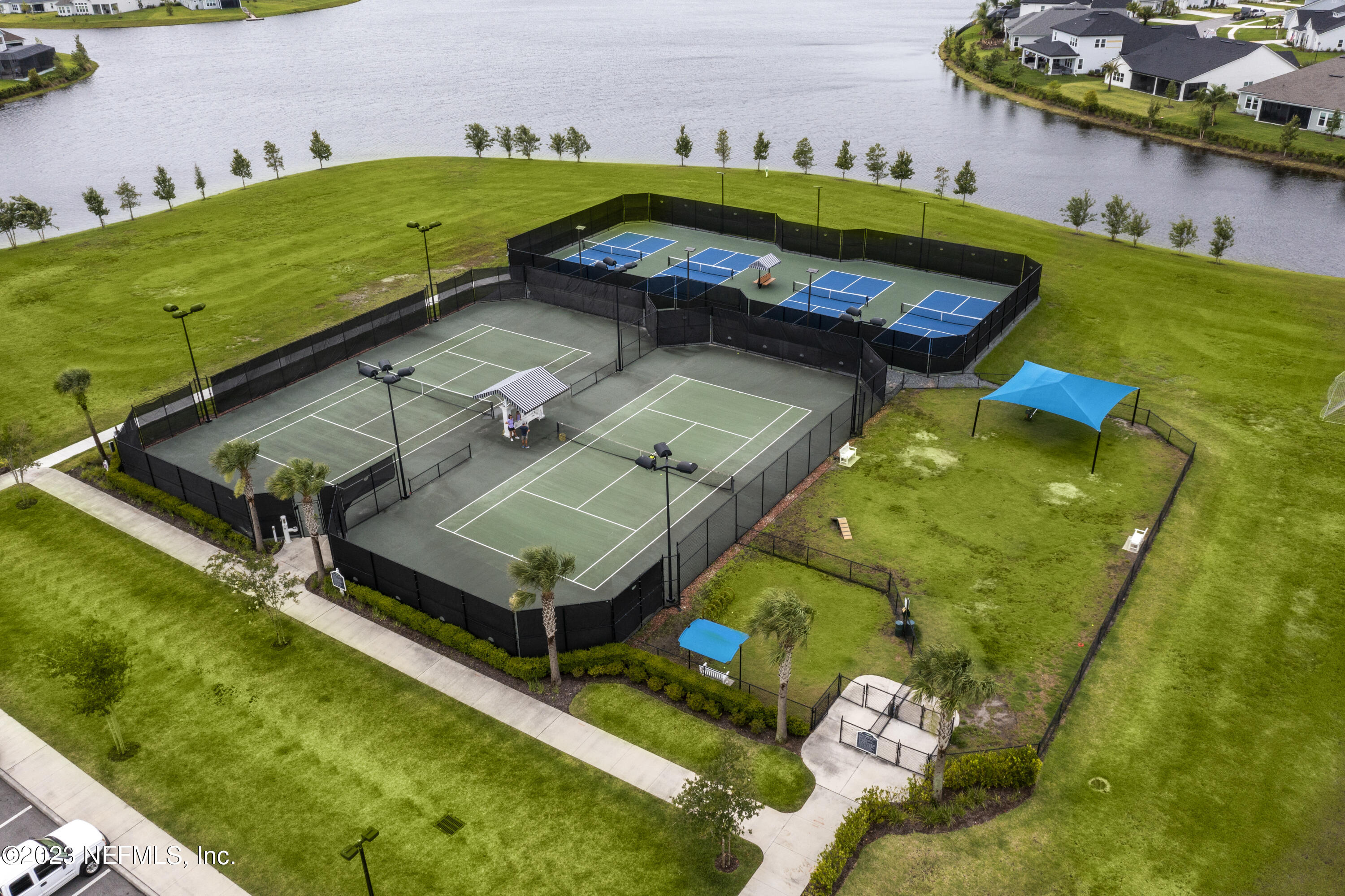 36 Strobe Court St. Augustine, FL 32095 - Photo 44 of 47 a view of a swimming pool with a yard