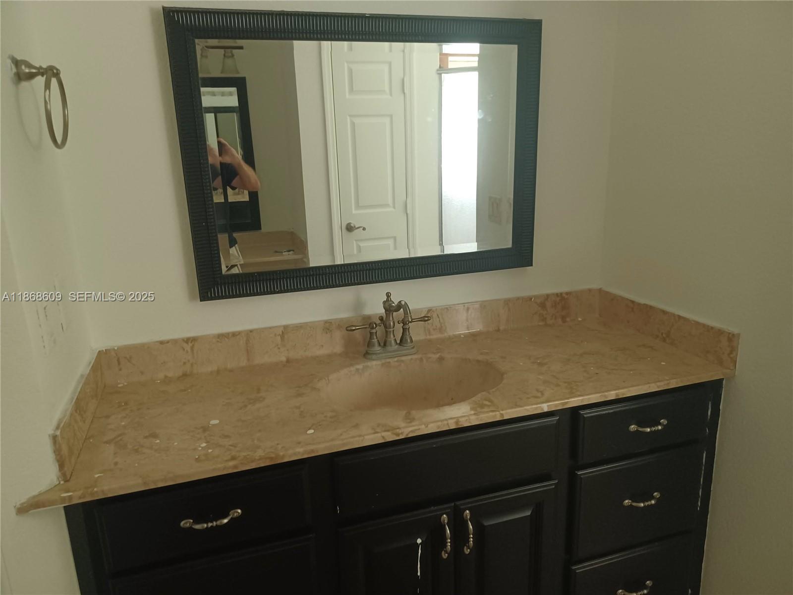 740 Arbuckle Creek Road Lorida, FL 33857 - Photo 17 of 21 a bathroom with a sink and a mirror