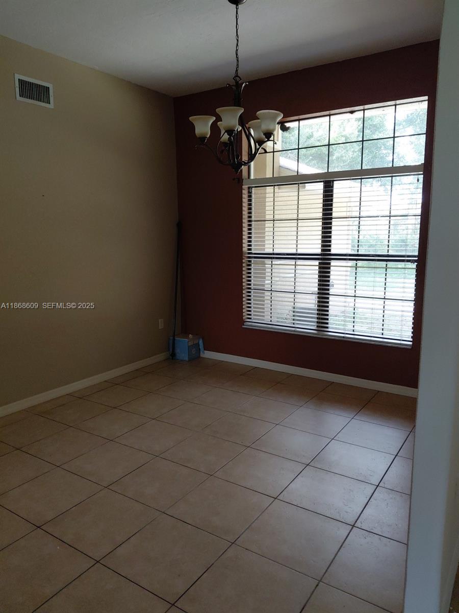 740 Arbuckle Creek Road Lorida, FL 33857 - Photo 7 of 21 a view of an empty room with a window