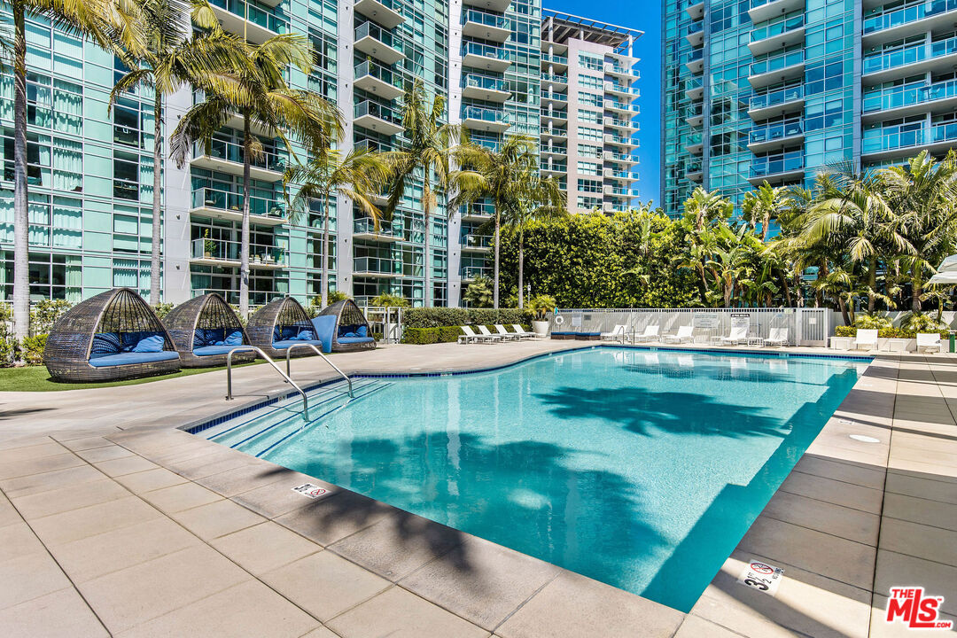 13700 Marina Pointe Drive, Unit PH 1903 Marina del Rey, CA 90292 - Photo 13 of 35 a view of a swimming pool with a patio