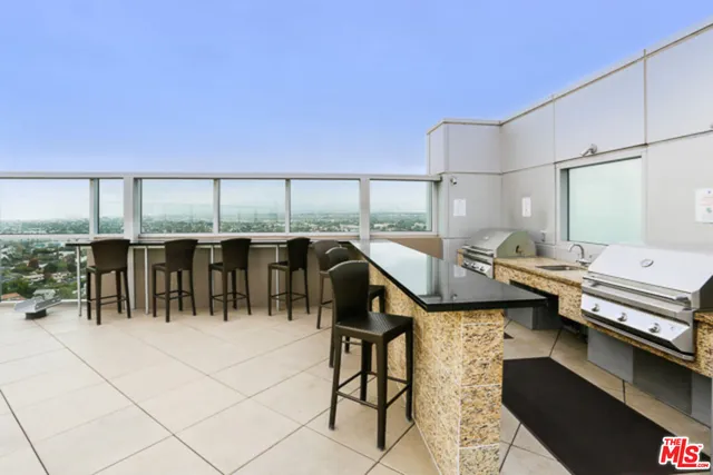 a view of a living room and a balcony