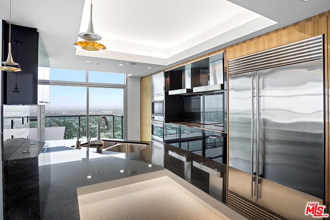 13700 Marina Pointe Drive, Unit PH 1903 Marina del Rey, CA 90292 - Photo 20 of 35 a view of a living room and a balcony