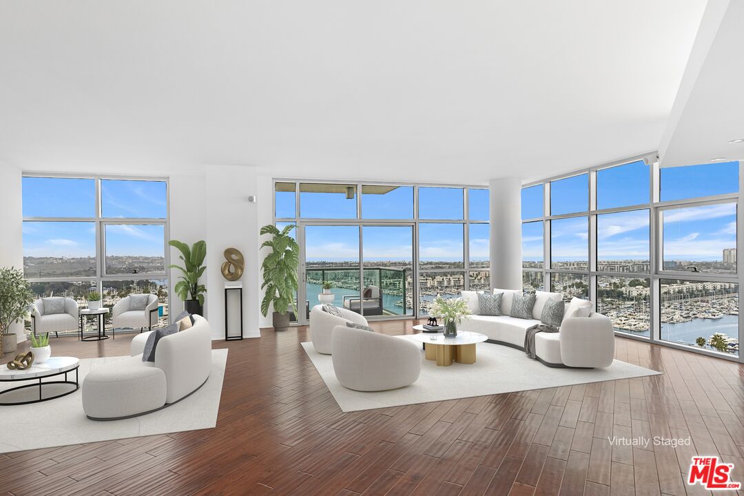 13700 Marina Pointe Drive, Unit PH 1903 Marina del Rey, CA 90292 - Photo 24 of 35 a living room with furniture and a large window