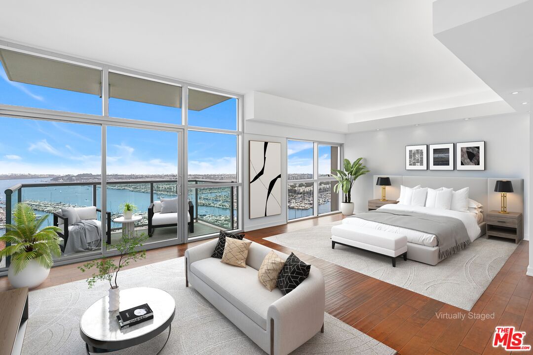 13700 Marina Pointe Drive, Unit PH 1903 Marina del Rey, CA 90292 - Photo 27 of 35 a living room with furniture and a wooden floor
