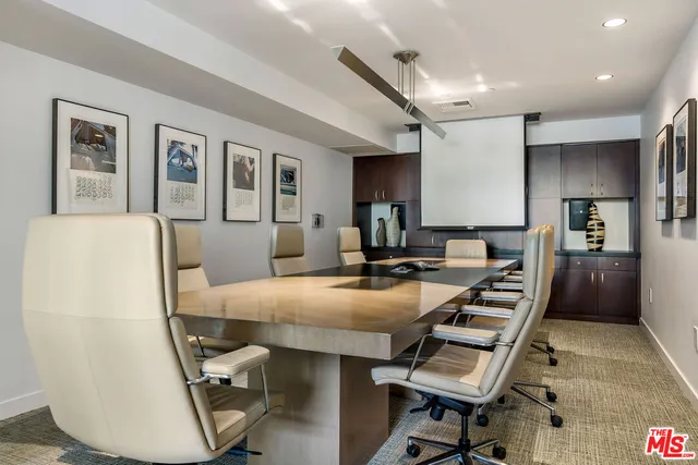 a large kitchen with a table and chairs