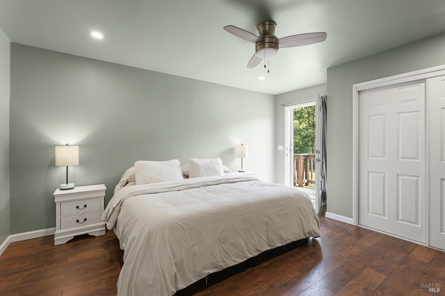 8251 East Potter Valley Road Ukiah, CA 95482 - Photo 14 of 29 a bedroom with a bed and a chandelier