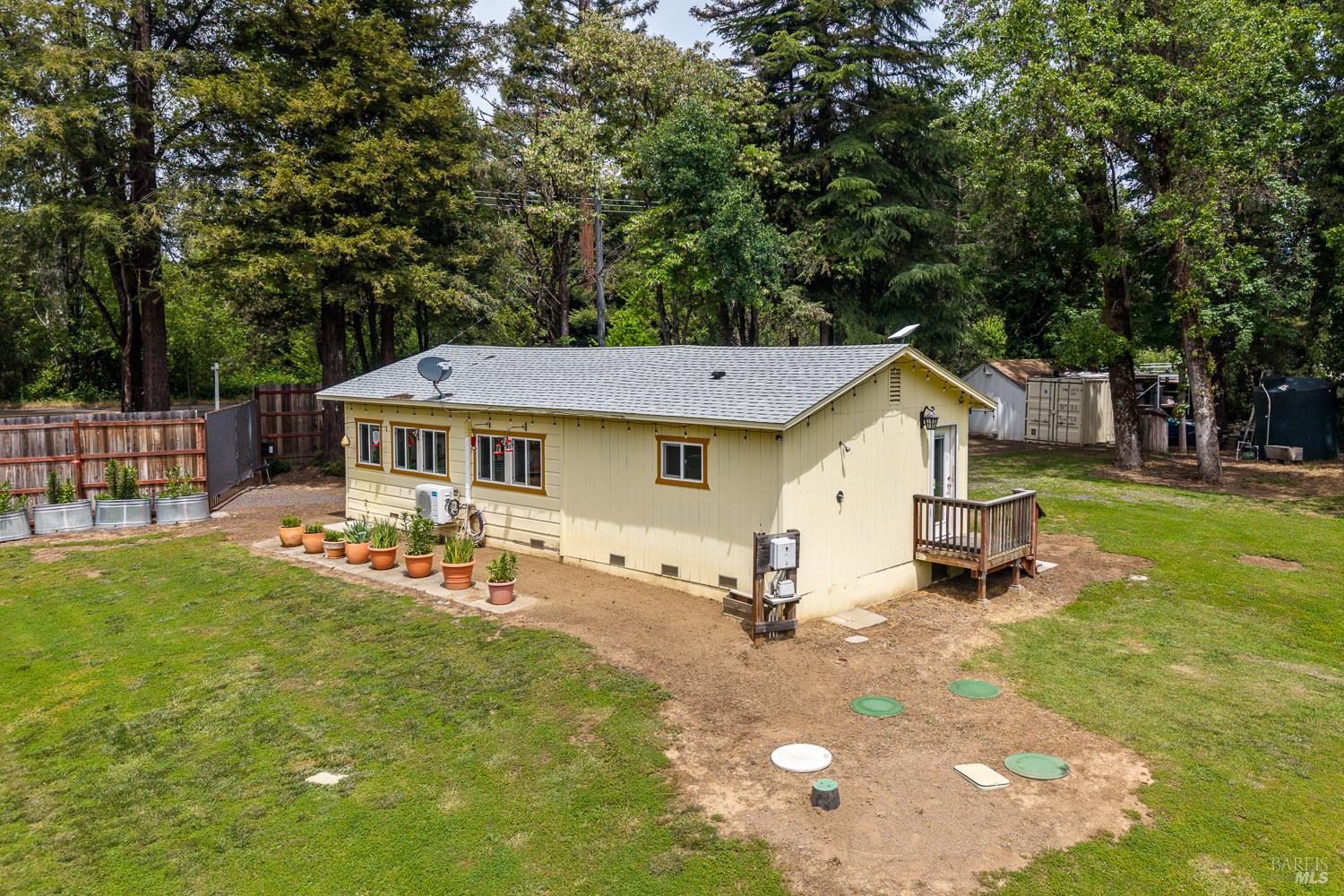 8251 East Potter Valley Road Ukiah, CA 95482 - Photo 18 of 29 a view of a house with backyard and sitting area